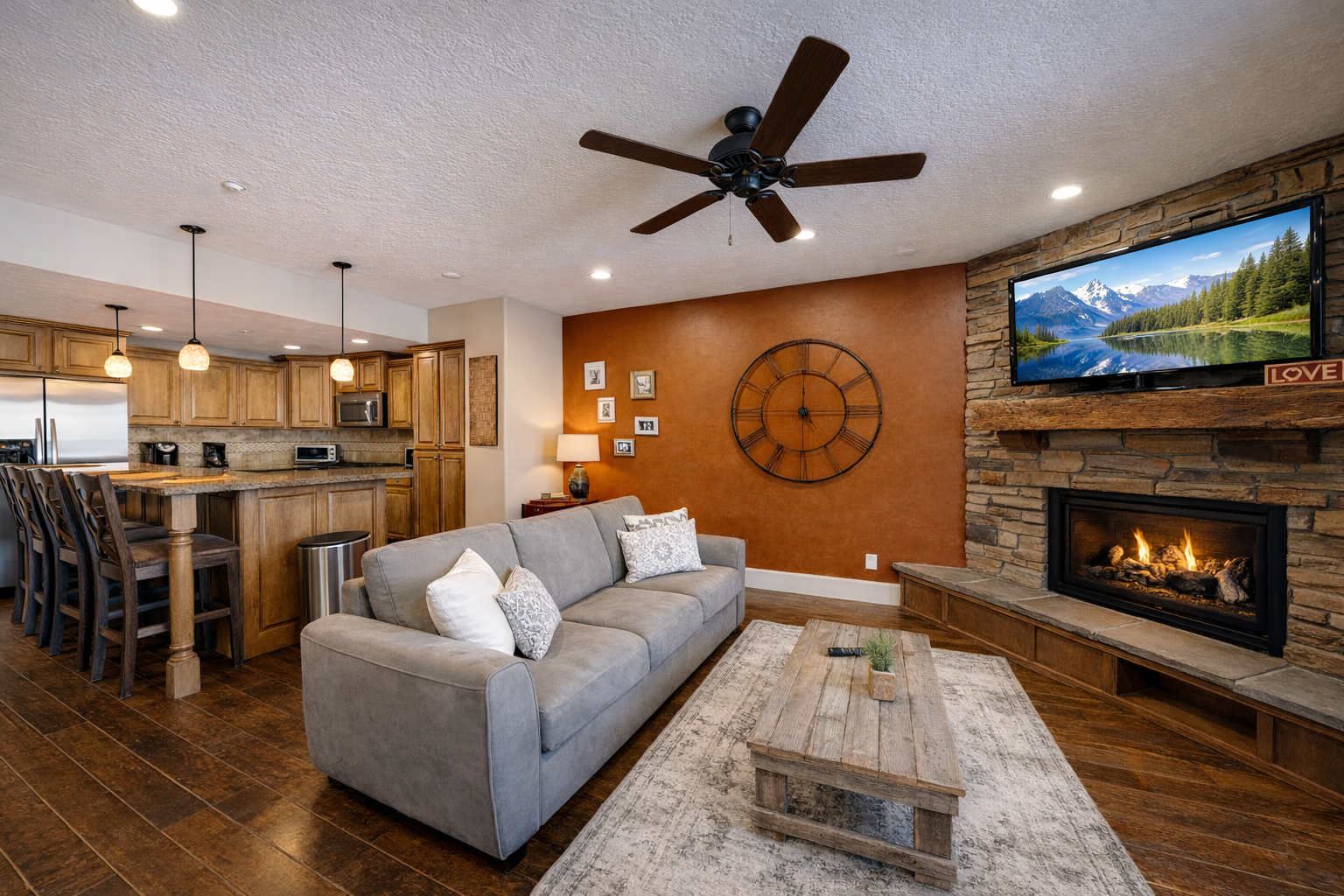 Cozy up by your crackling fireplace while enjoying mountain views on the big screen in this warm, open-concept retreat.