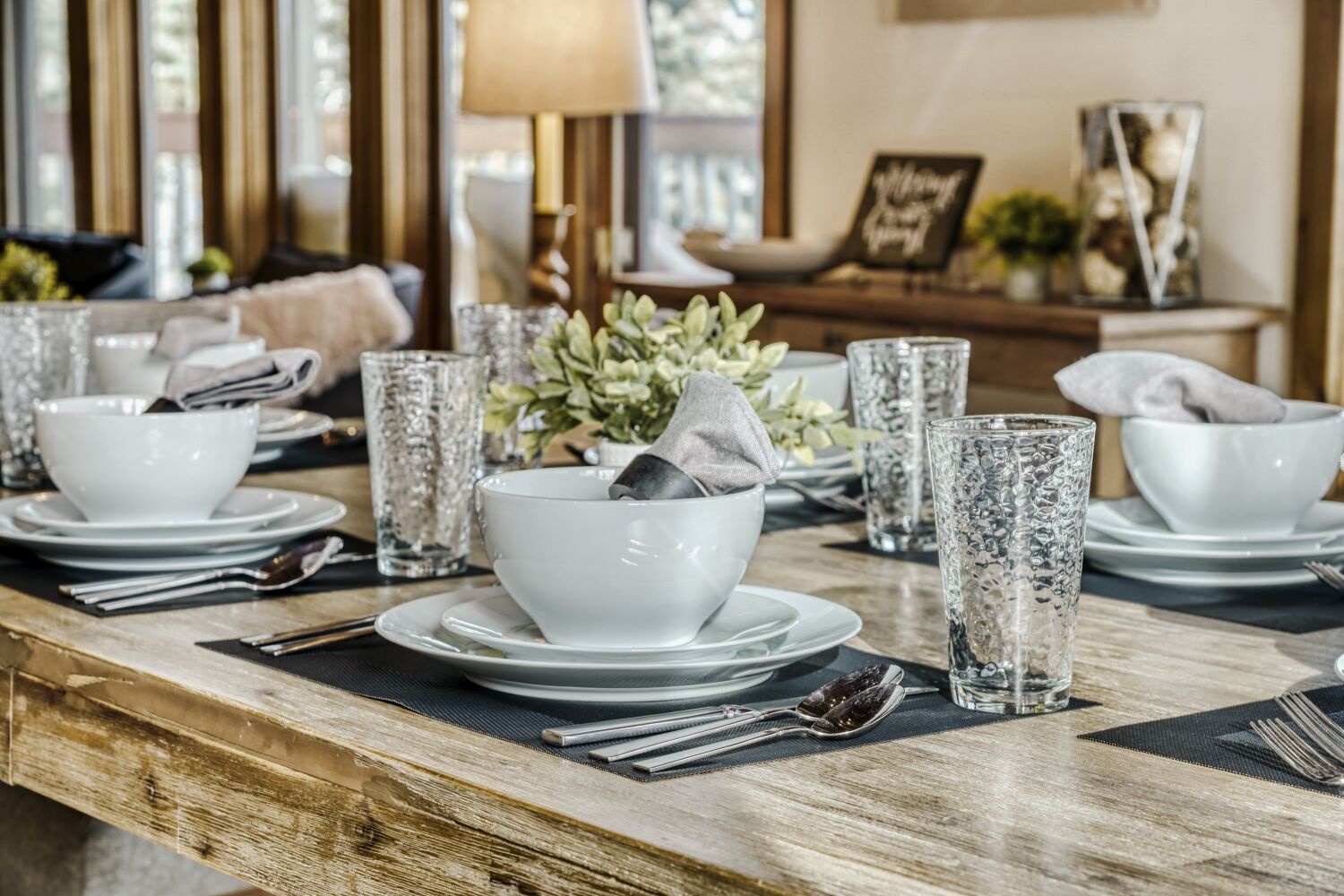 You'll love gathering around this beautifully set dining table with elegant dinnerware and fresh touches that make every meal feel special.