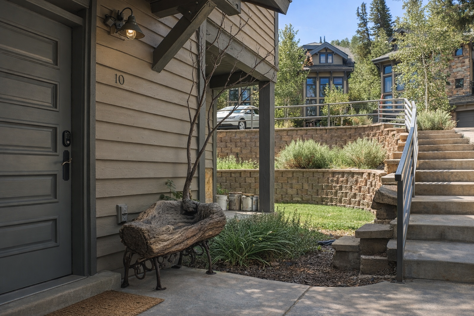 Step onto the covered porch and relax on the unique log bench. This cozy entry is your first step into a perfect mountain getaway.