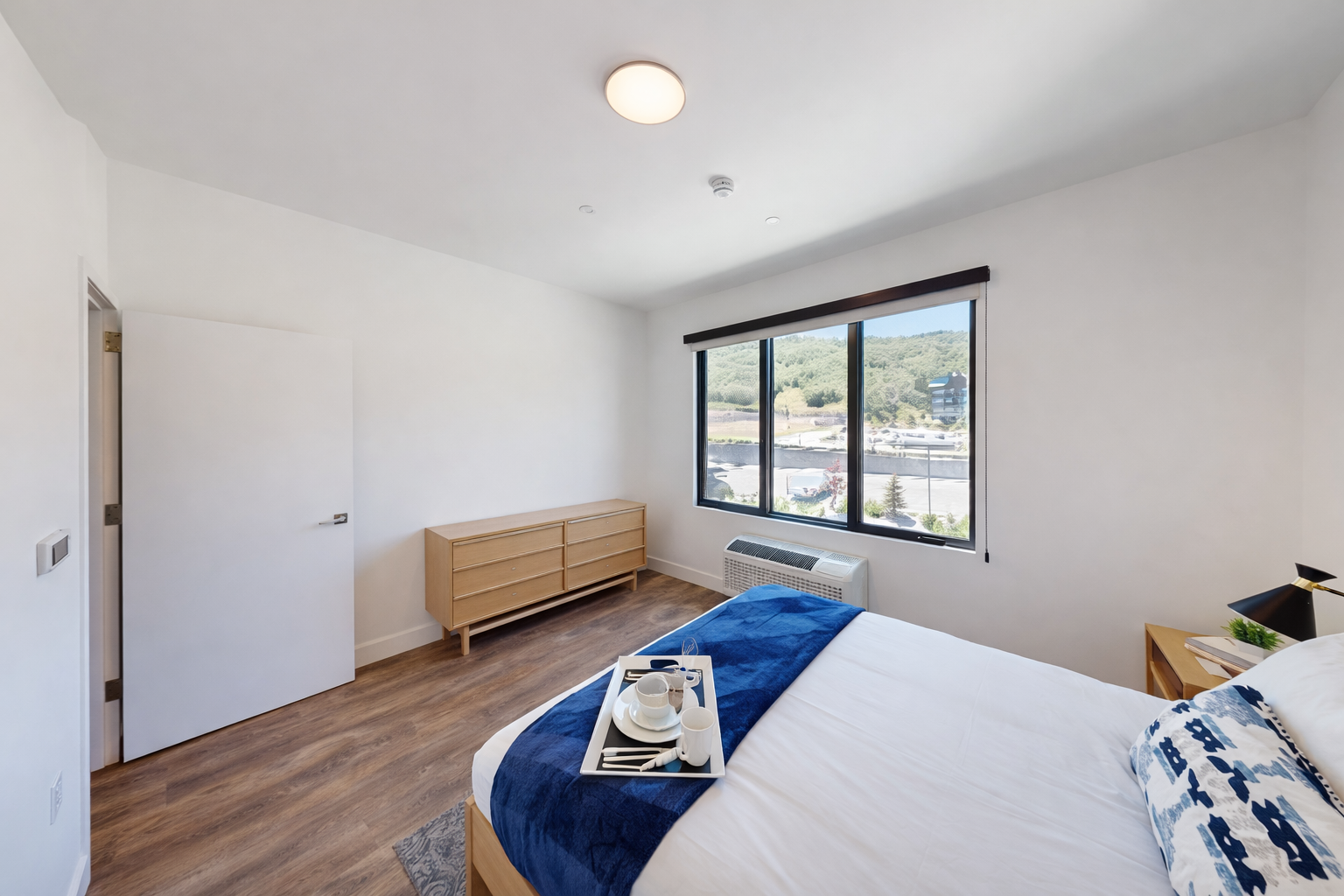 Wake up in your bright, modern bedroom with stunning views and thoughtful touches like breakfast in bed service.