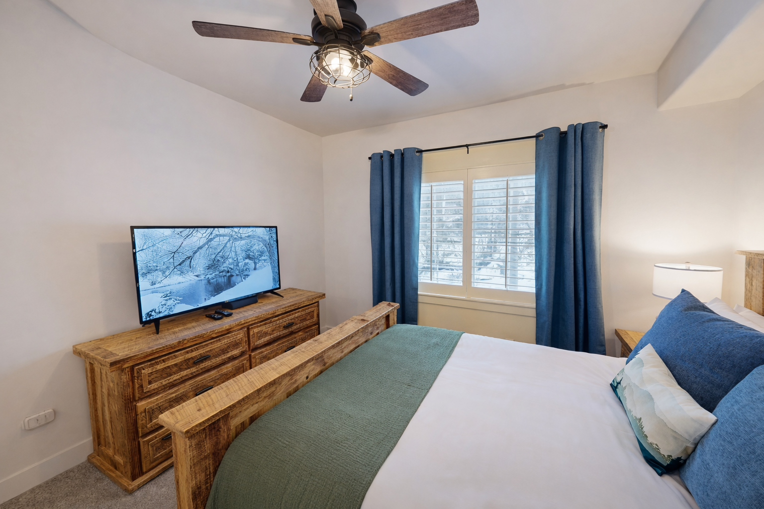 Stay in this mountain-inspired bedroom featuring a queen bed and cozy accents. Part of a luxury Park City townhome just 2 miles from the Canyons ski slopes