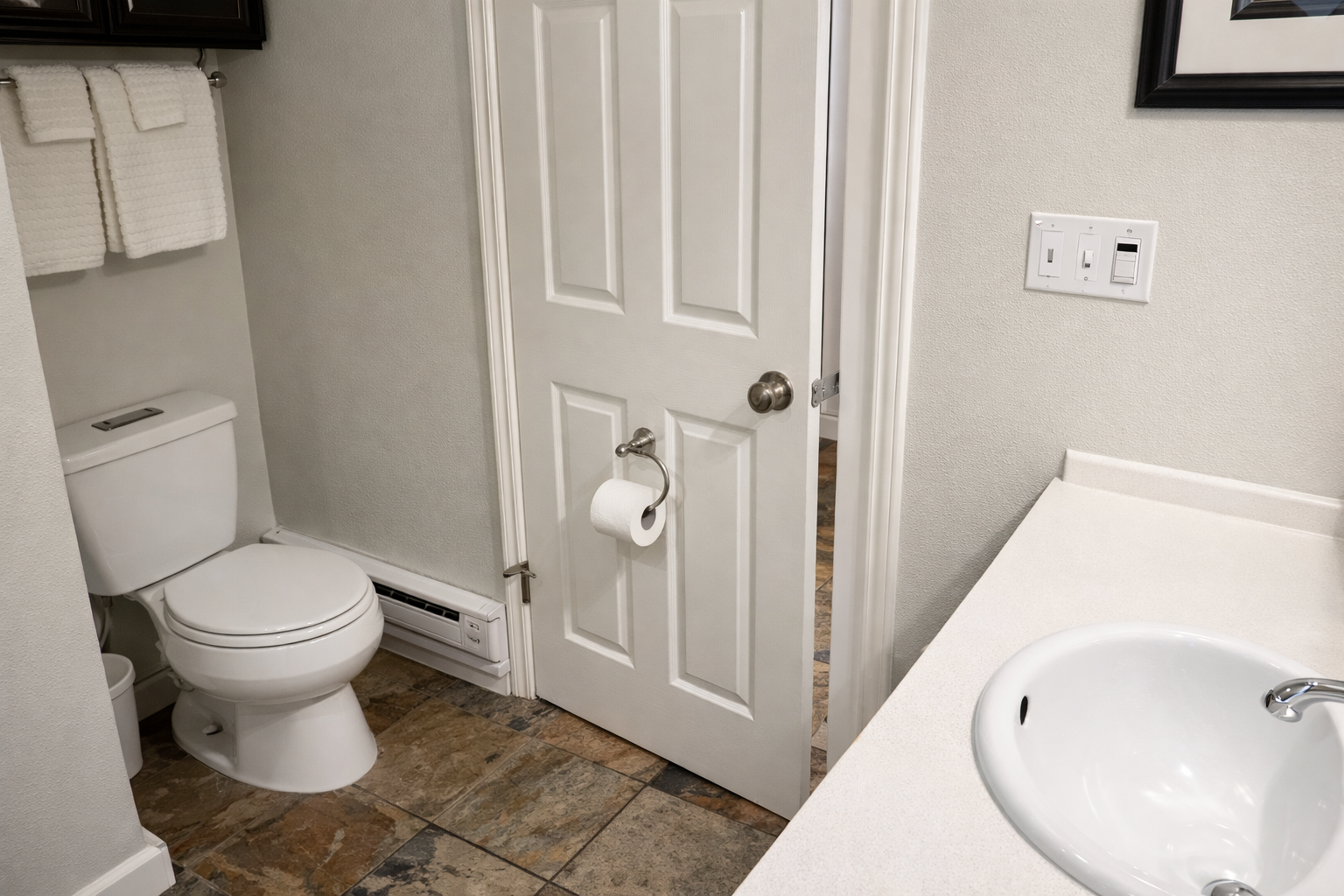 Compact & clean full bathroom with essential amenities for your comfort.