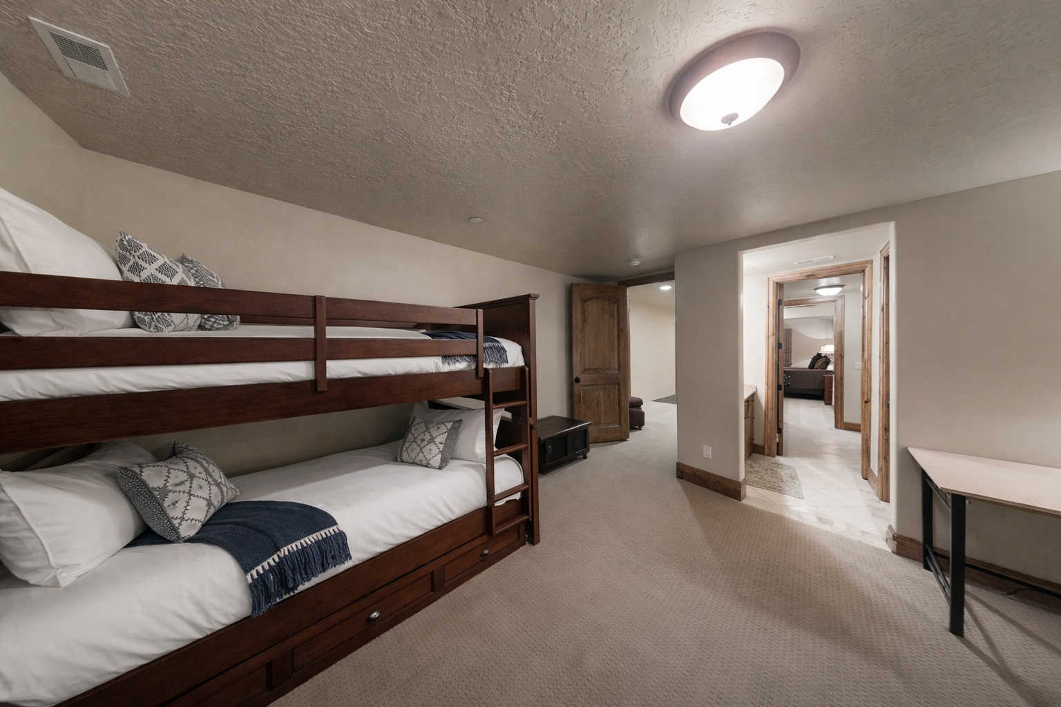 Your family will love this cozy bunk room with quality linens and plenty of space to unwind together after a day of adventures.