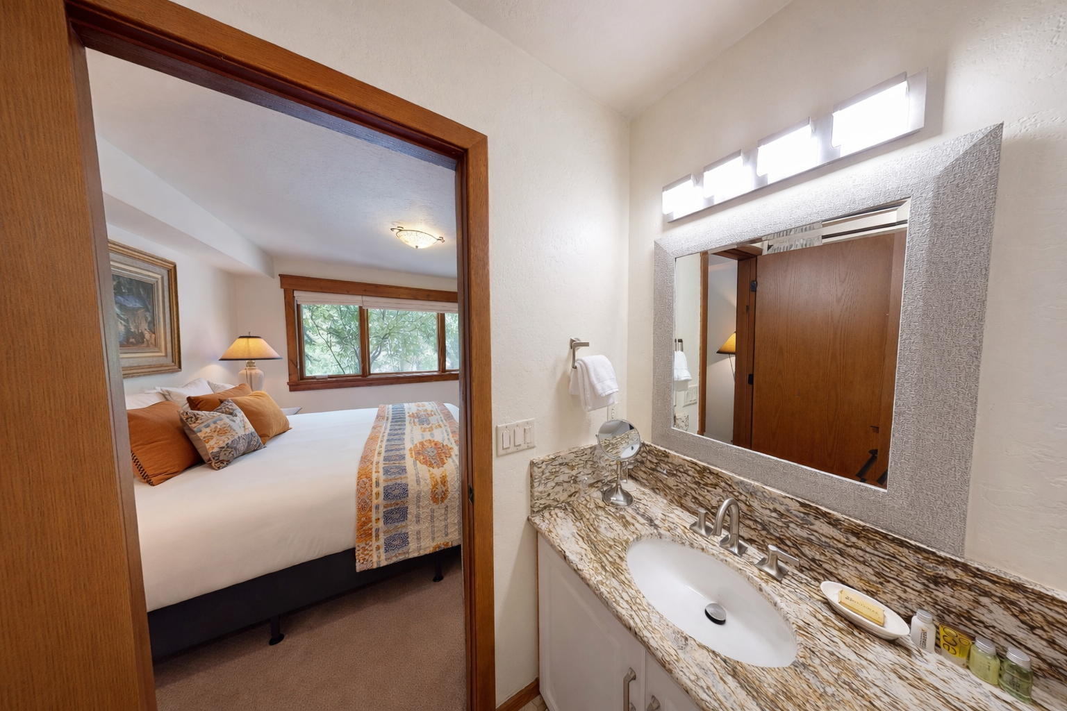 Your private bathroom features elegant granite countertops and connects directly to your cozy bedroom retreat.