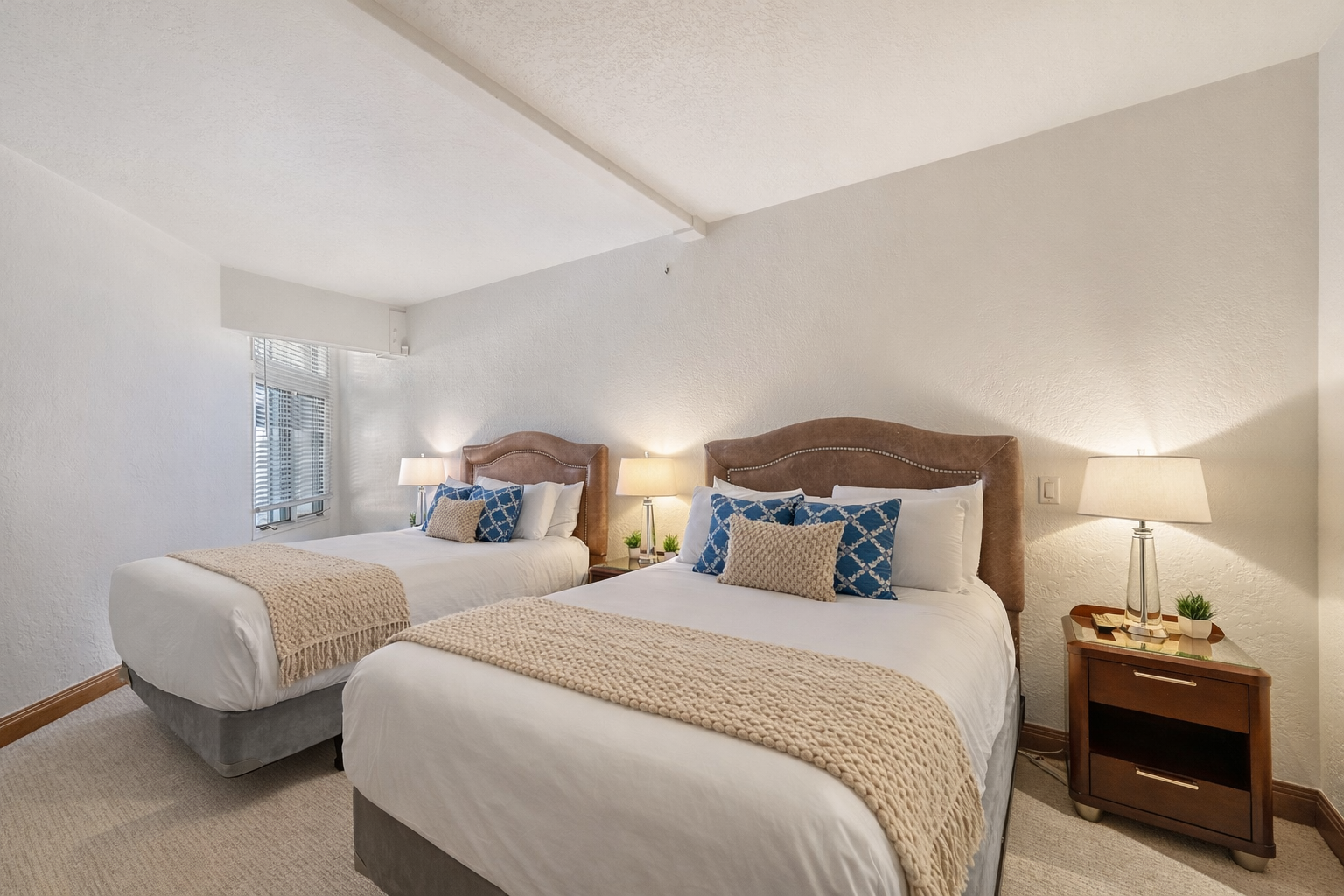Settle into your comfortable twin bedroom with crisp linens, elegant décor, and thoughtful touches that promise a restful night's sleep.