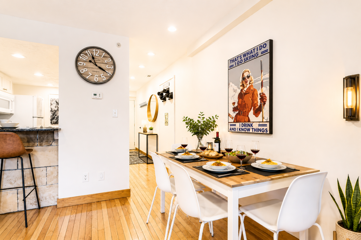 Gather around the dining table for memorable meals in this bright, stylish space—warm wood tones, clever art, and thoughtful details make every bite a moment to savor.