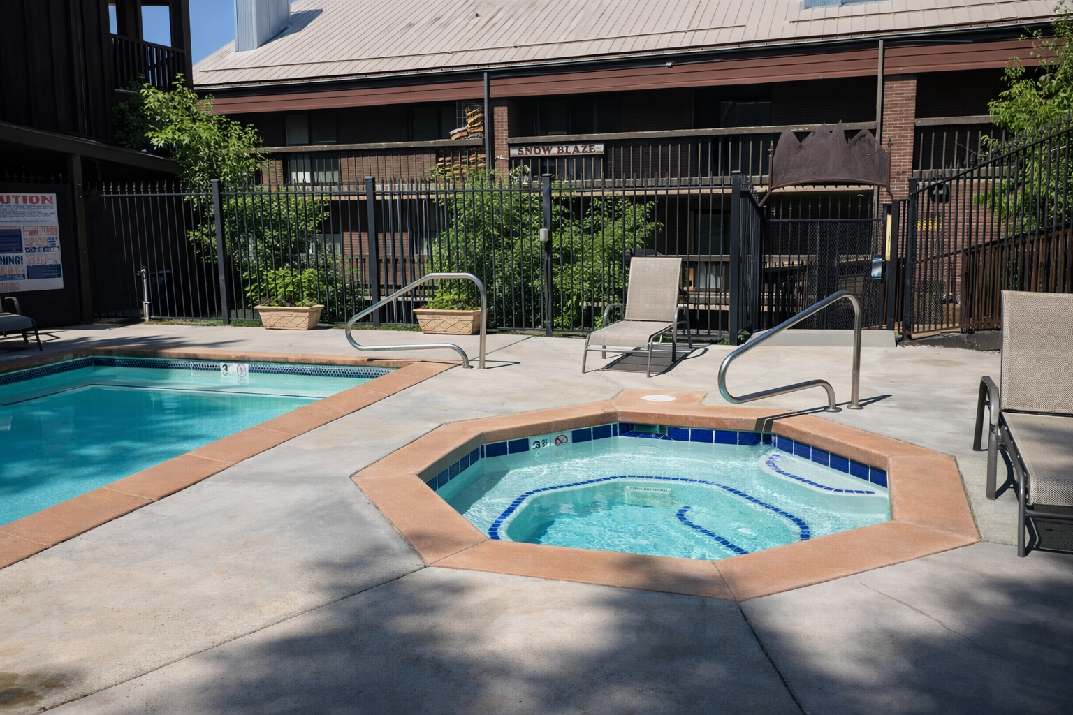 Soak away your stress in this inviting hot tub, perfectly positioned next to the sparkling pool for your ultimate relaxation experience.