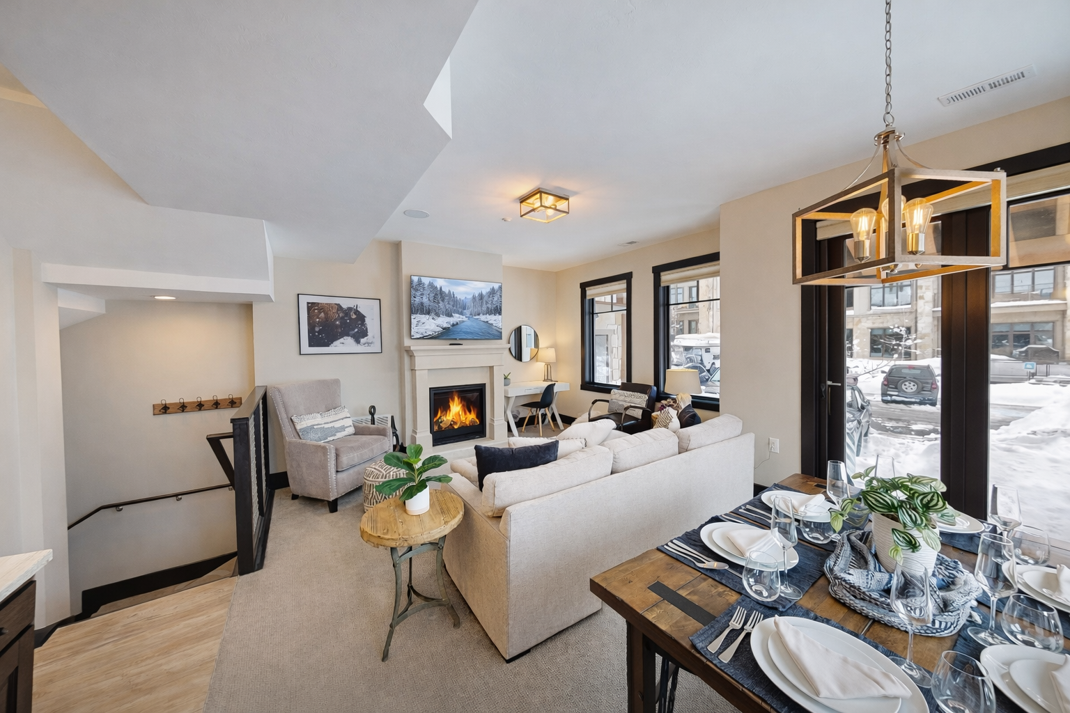 Cozy up by your crackling fireplace while winter views frame your elegant retreat, complete with plush seating and modern comforts.