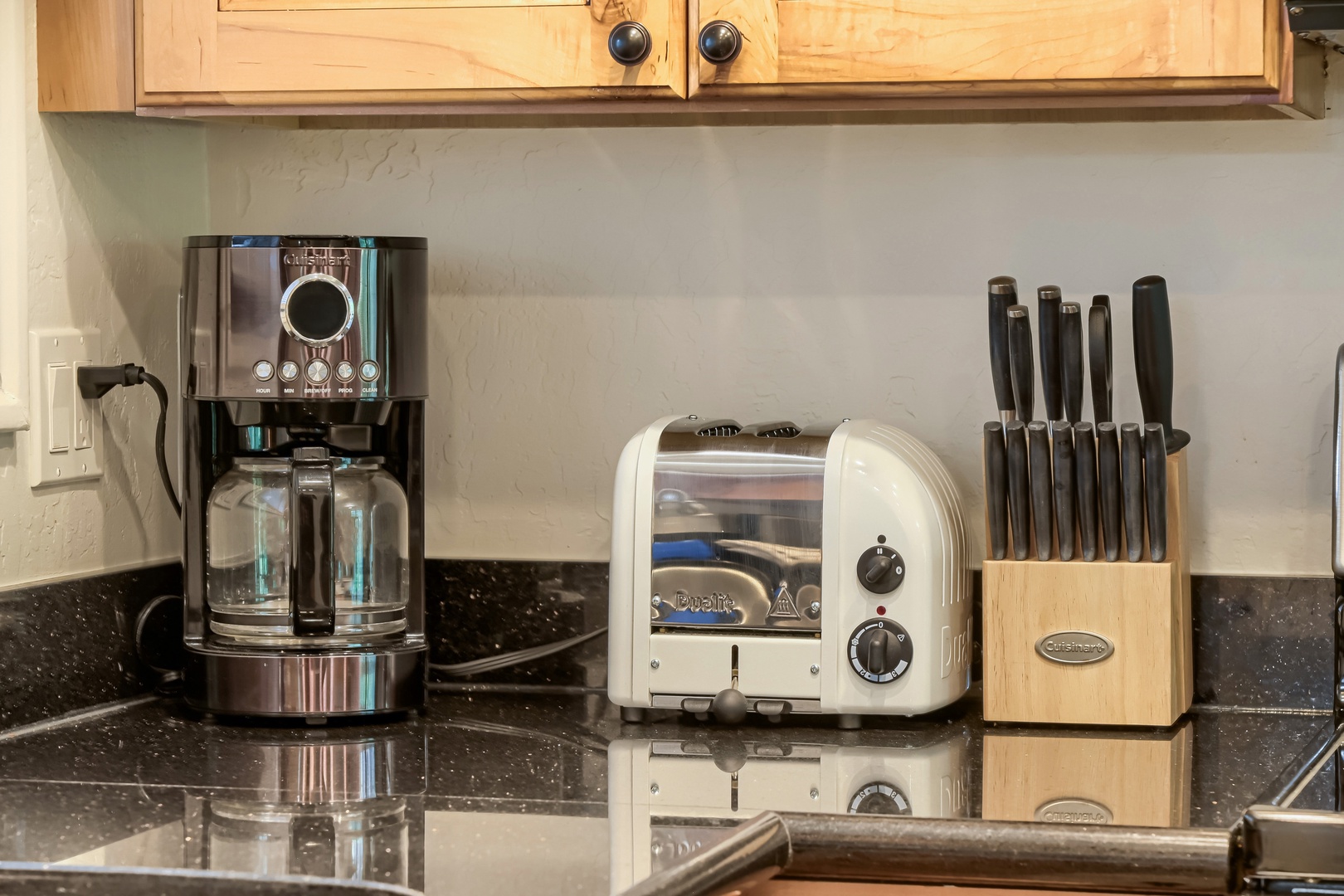 Start your mornings right with fresh coffee brewing and toast ready on the counter. Everything you need for a delicious breakfast is just steps away in your well-appointed kitchen.