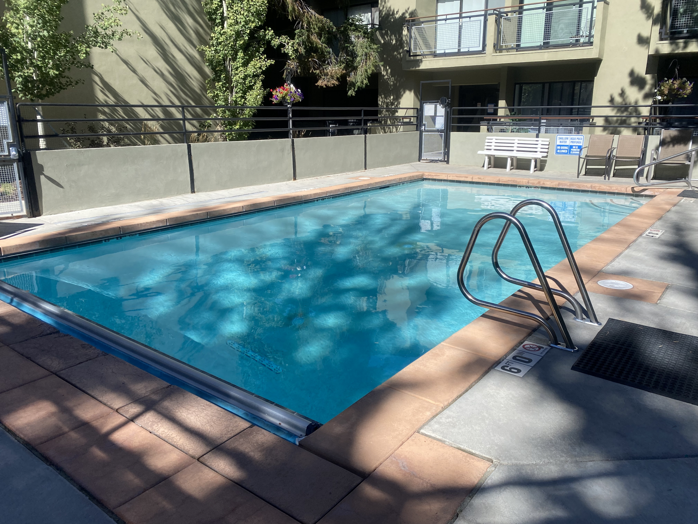 Cool off in your private pool, surrounded by shade trees and comfortable seating areas perfect for afternoon relaxation.