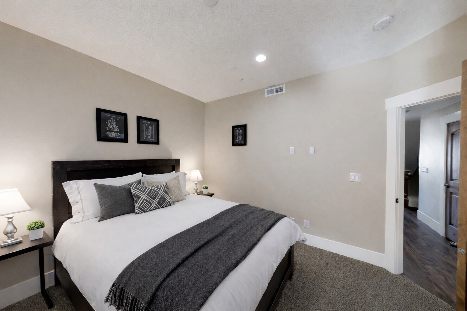 Sink into crisp white linens and soft pillows in your peaceful bedroom retreat, perfectly styled for restful nights.