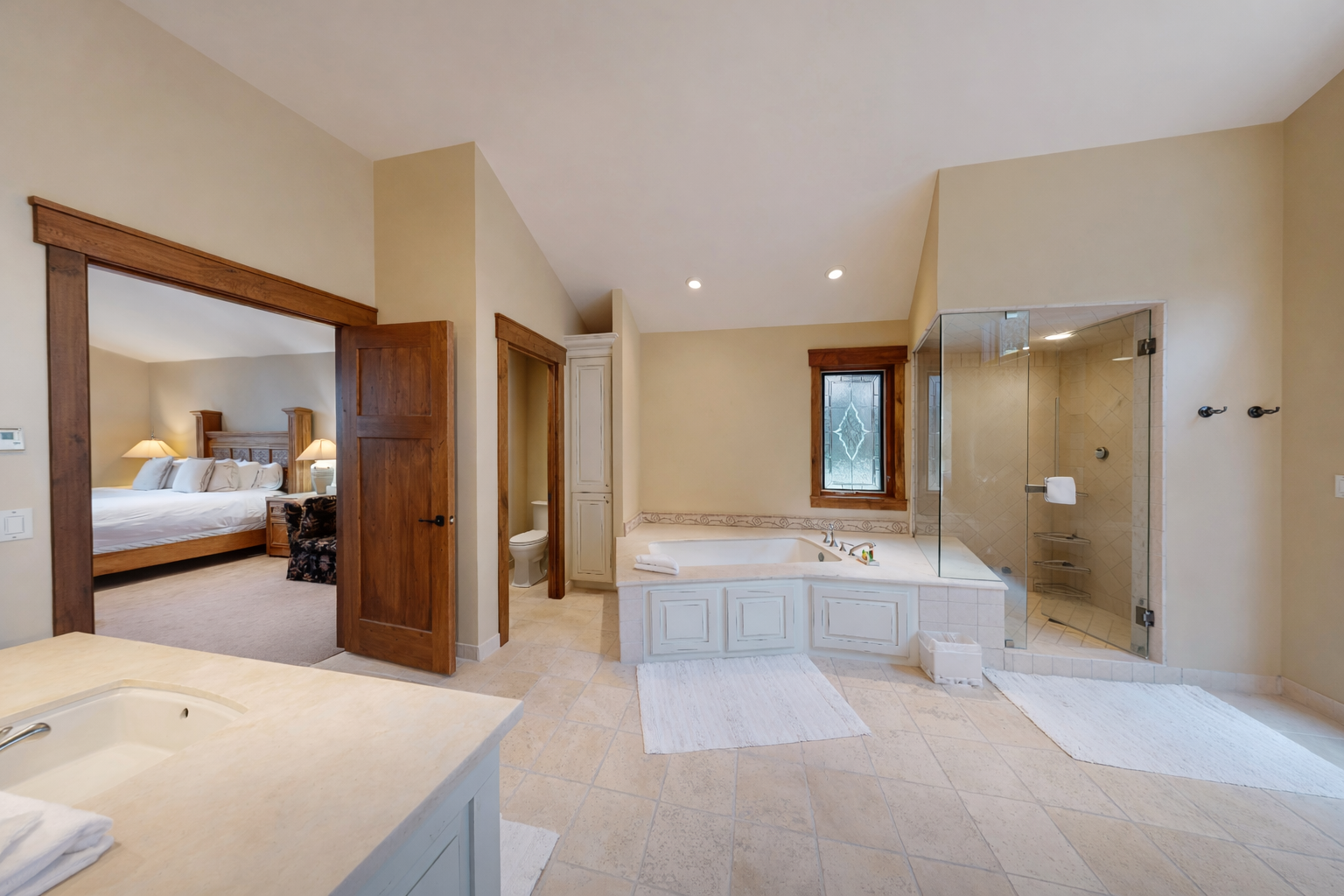 Indulge in your private spa-like ensuite with soaking tub, spacious shower, and direct bedroom access for ultimate relaxation.