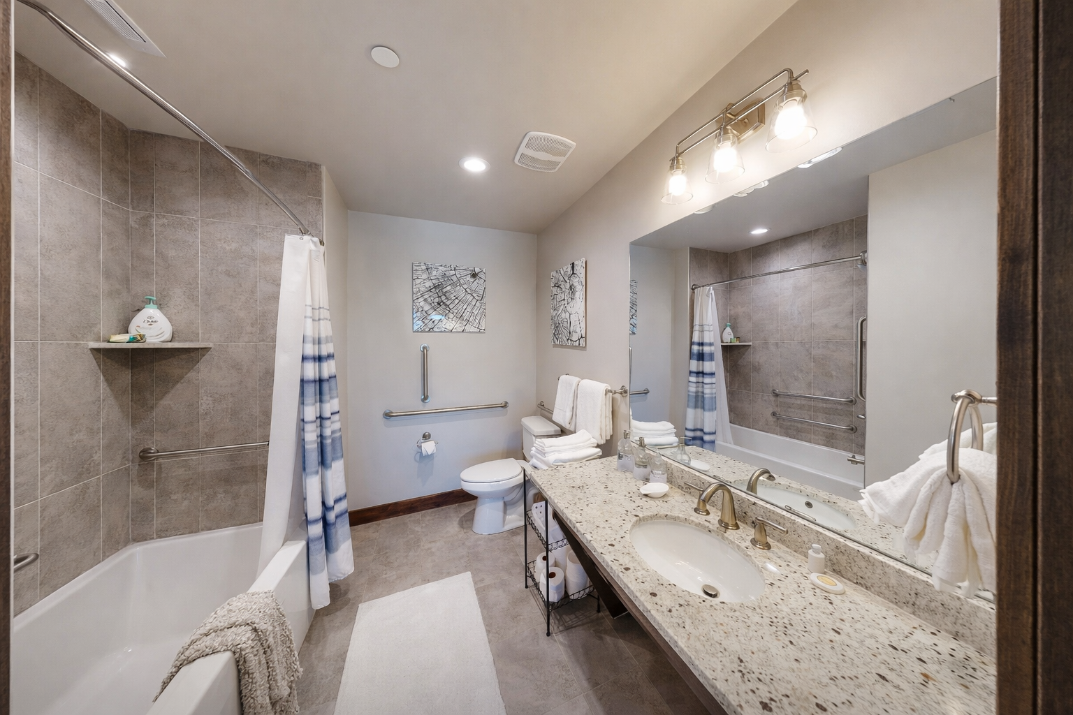 Your spacious bathroom features granite countertops, a luxurious soaking tub, and thoughtful accessibility features for ultimate comfort.