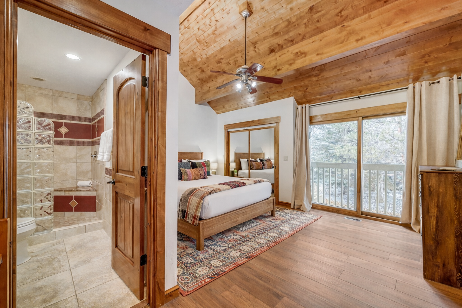 Your cozy retreat features rustic wood beams, a plush king bed, and serene forest views from your private balcony.