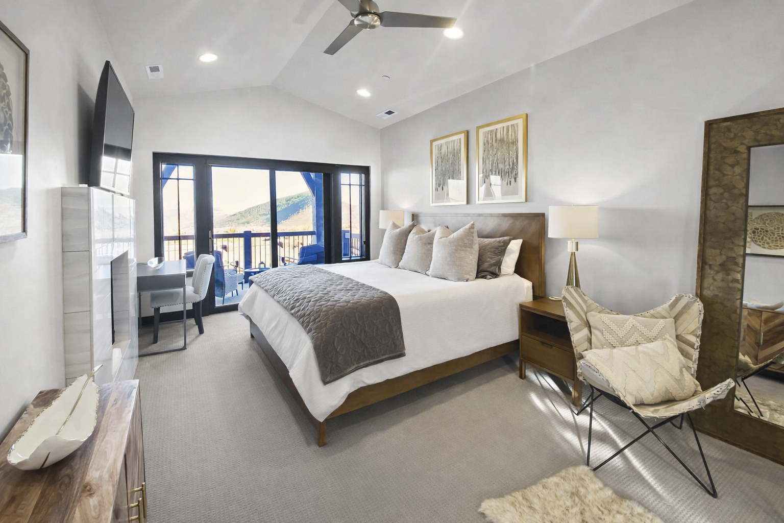 Drift off to sleep in your elegant master suite with mountain views from your private balcony and modern furnishings.