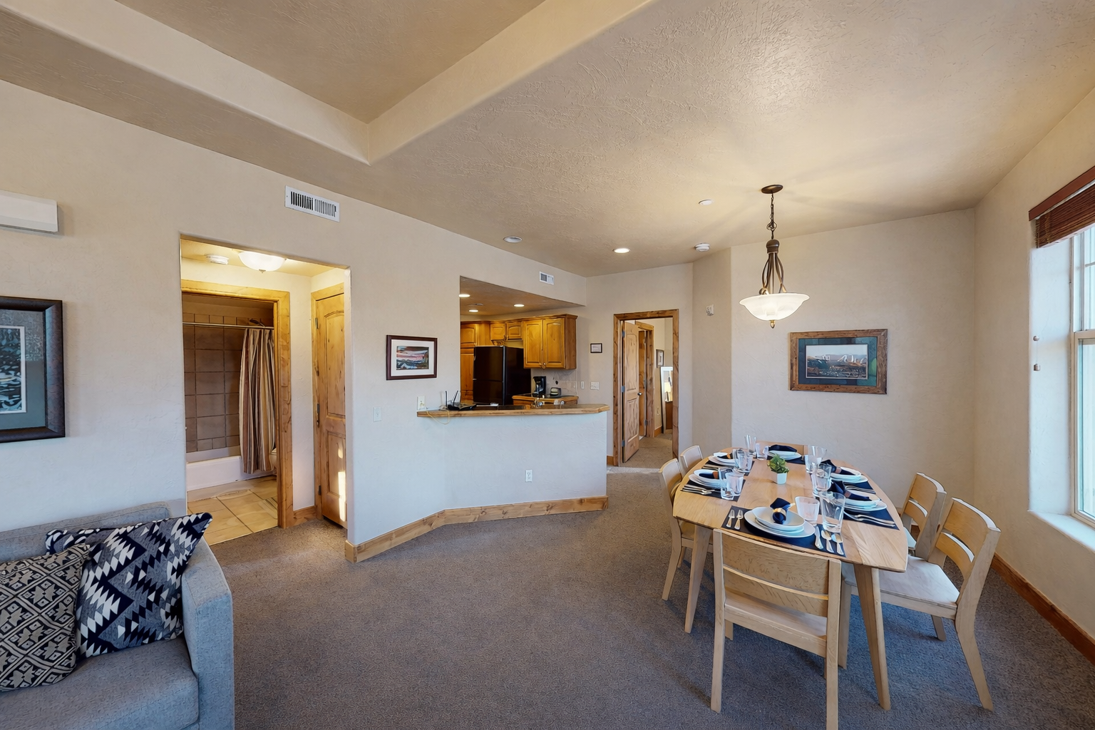 Gather around your spacious dining table for memorable meals, with an open kitchen nearby for easy entertaining.