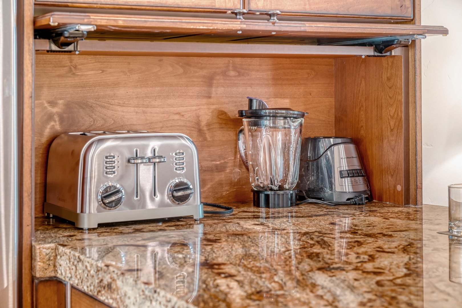 Your fully equipped kitchen features premium appliances including a sleek toaster and blender, perfect for preparing fresh meals during your stay.