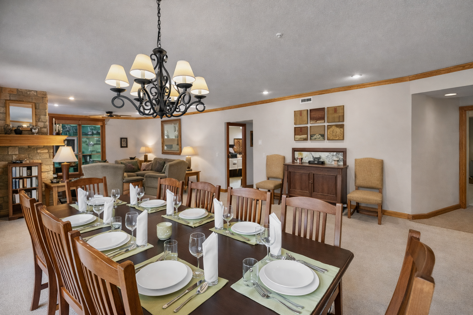 Spacious dining area with seating for large groups. Perfect for shared meals and entertaining during your memorable mountain getaway. Enjoy bright windows and rustic charm.