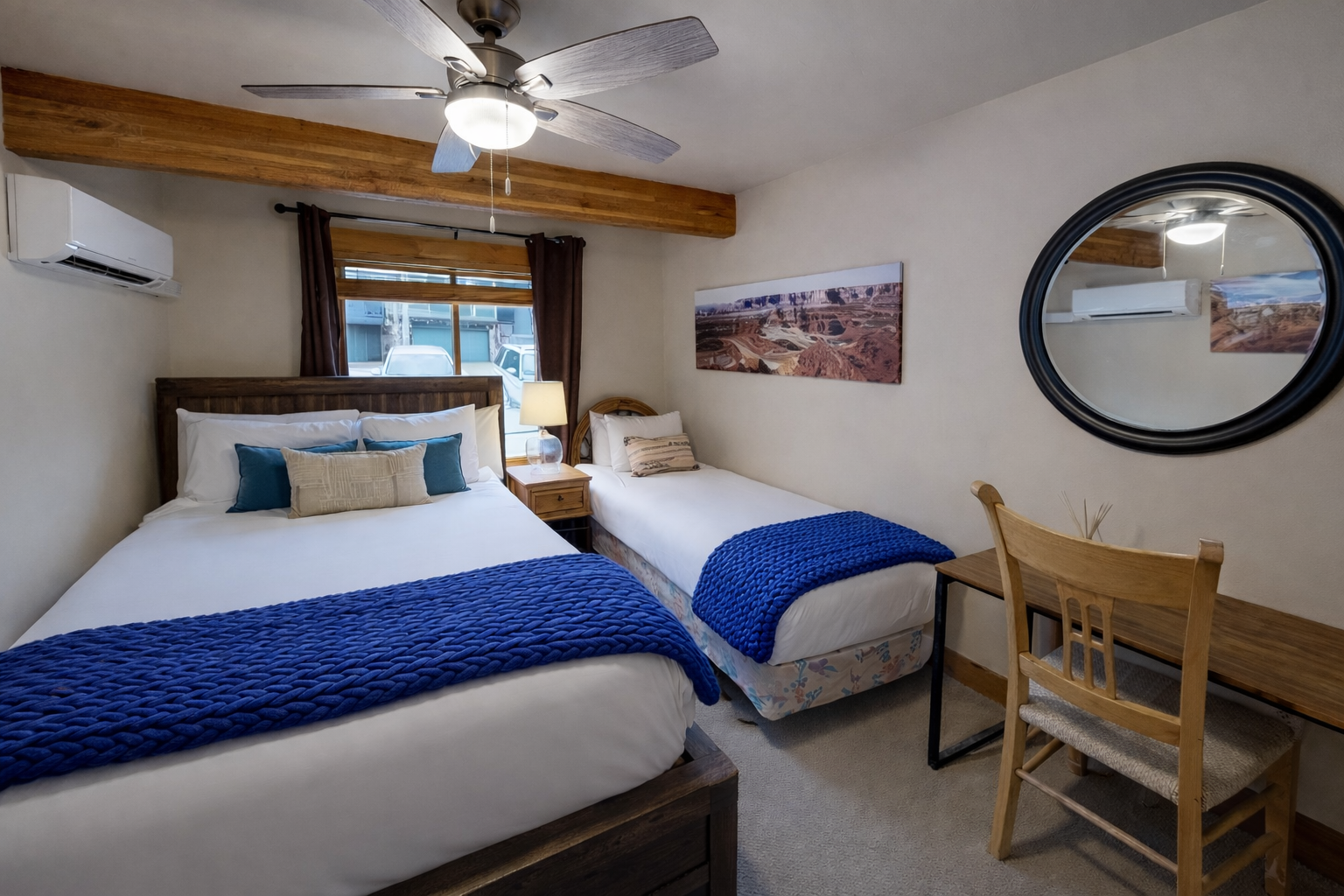 Relax in your cozy twin bedroom with rustic wood beams, crisp linens, and gentle natural light filtering through.