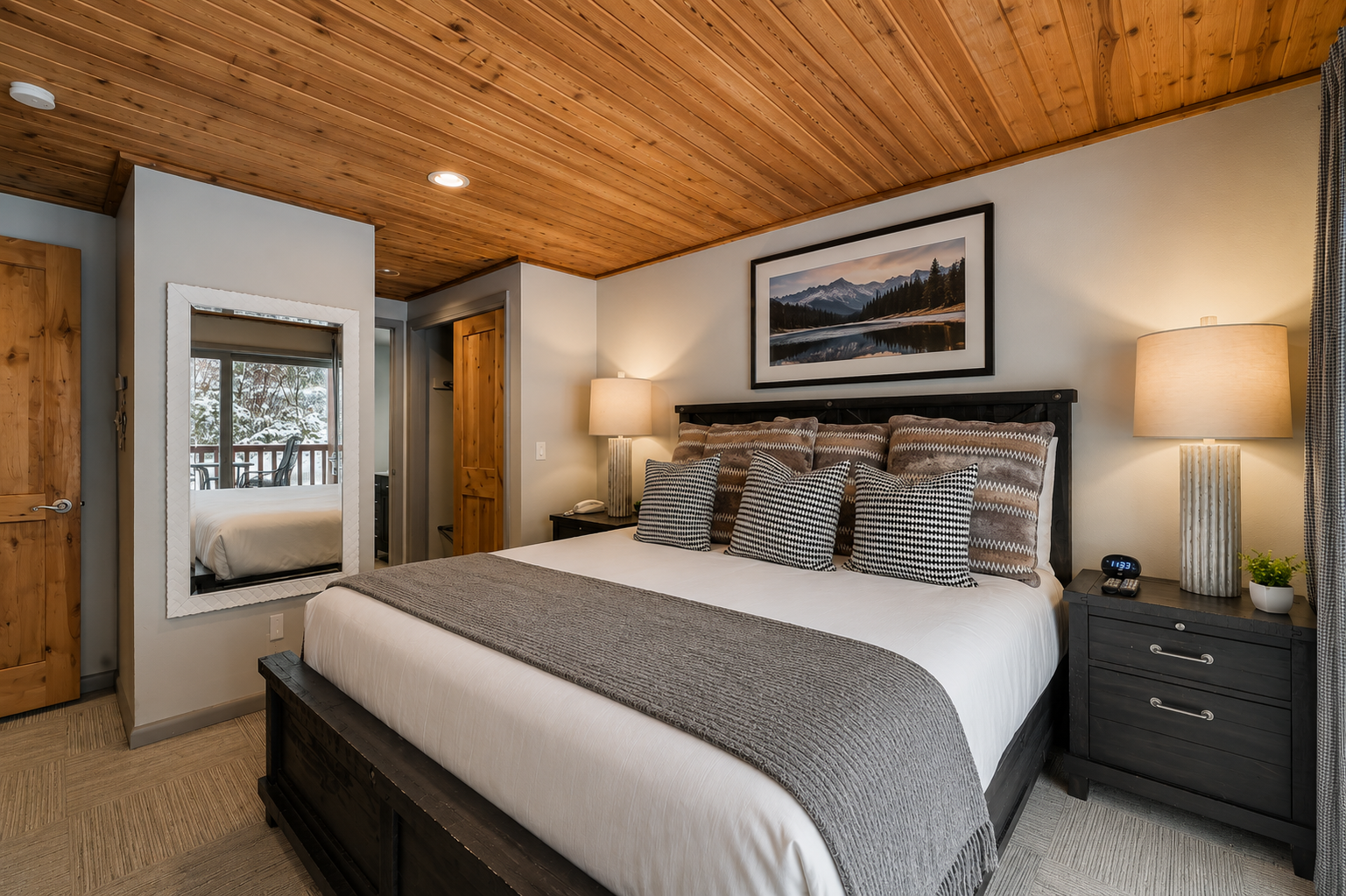 Unwind in your private retreat beneath stunning wood-plank ceilings. Crisp linens, soft lighting, and mountain-inspired art create a peaceful sanctuary for restful nights.