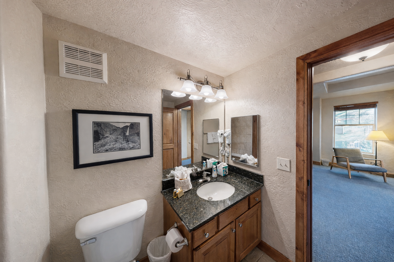 Cozy full bathroom with a granite vanity, ample counter space, and a combination tub/shower for a relaxing soak after your day exploring