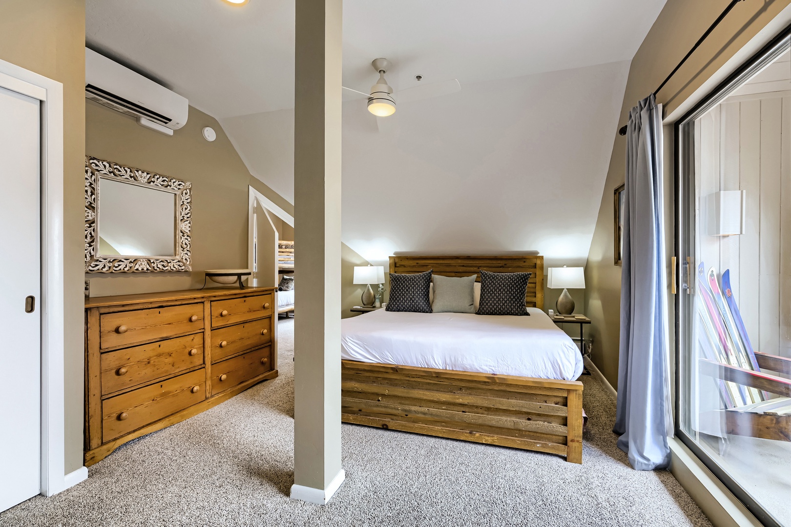 Unwind in your upstairs bedroom retreat, where soft carpeting, thoughtfully curated furnishings, and gentle lighting create the perfect sanctuary for restful nights.