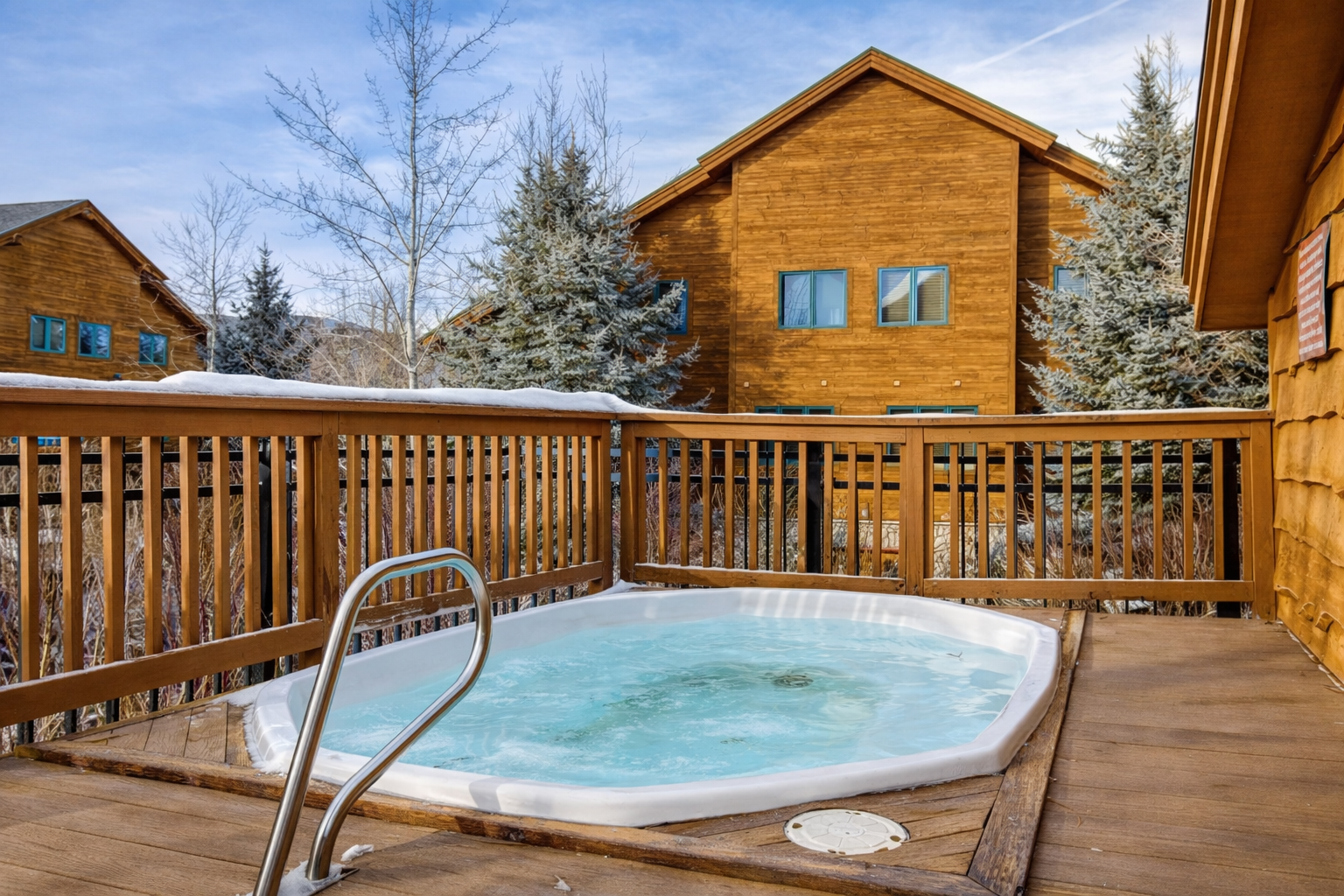 Soak away your day in the private hot tub on the deck, surrounded by snow-dusted trees. A serene and cozy spot for year-round relaxation and enjoyment.
