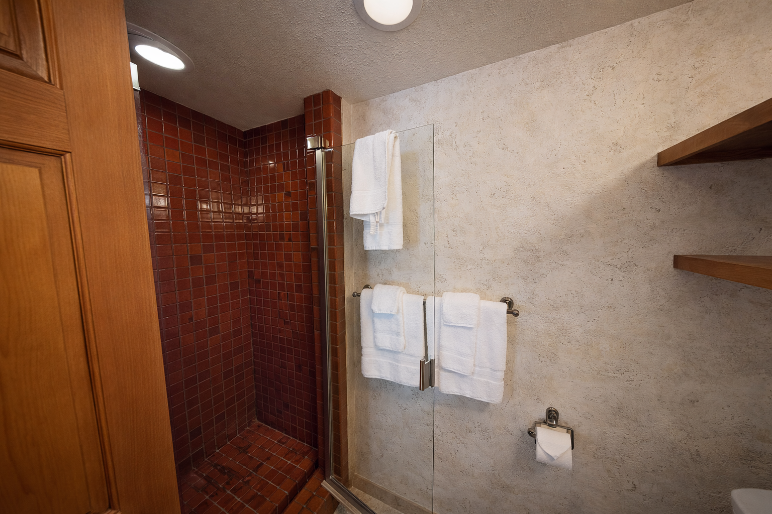 Refresh in our well-appointed bathroom with granite countertops, rustic wood accents, and a full set of amenities. Stocked for your comfort.