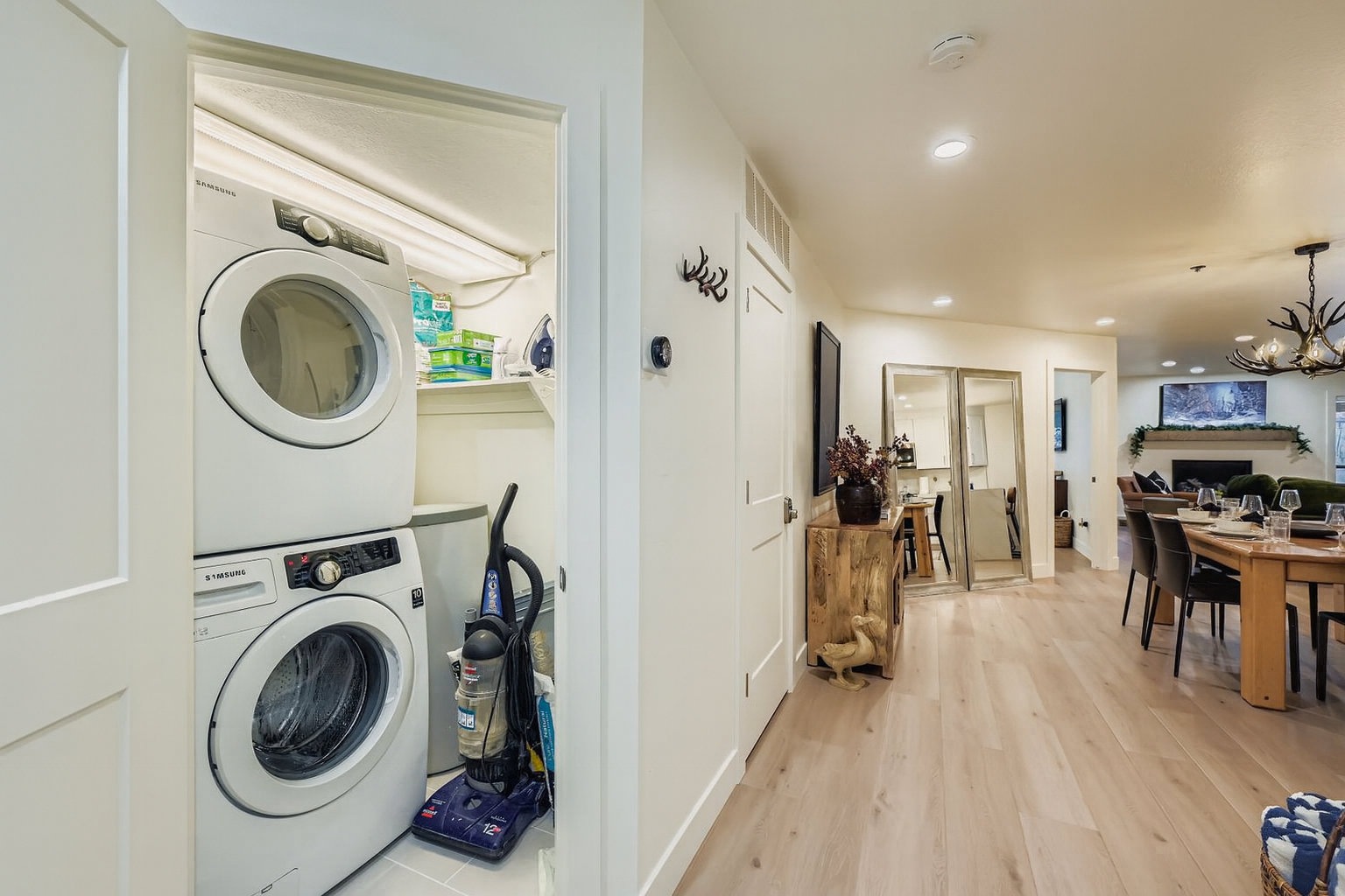 Convenient in-unit laundry keeps your stay comfortable, with a washer and dryer tucked neatly into your living space alongside the open dining area.