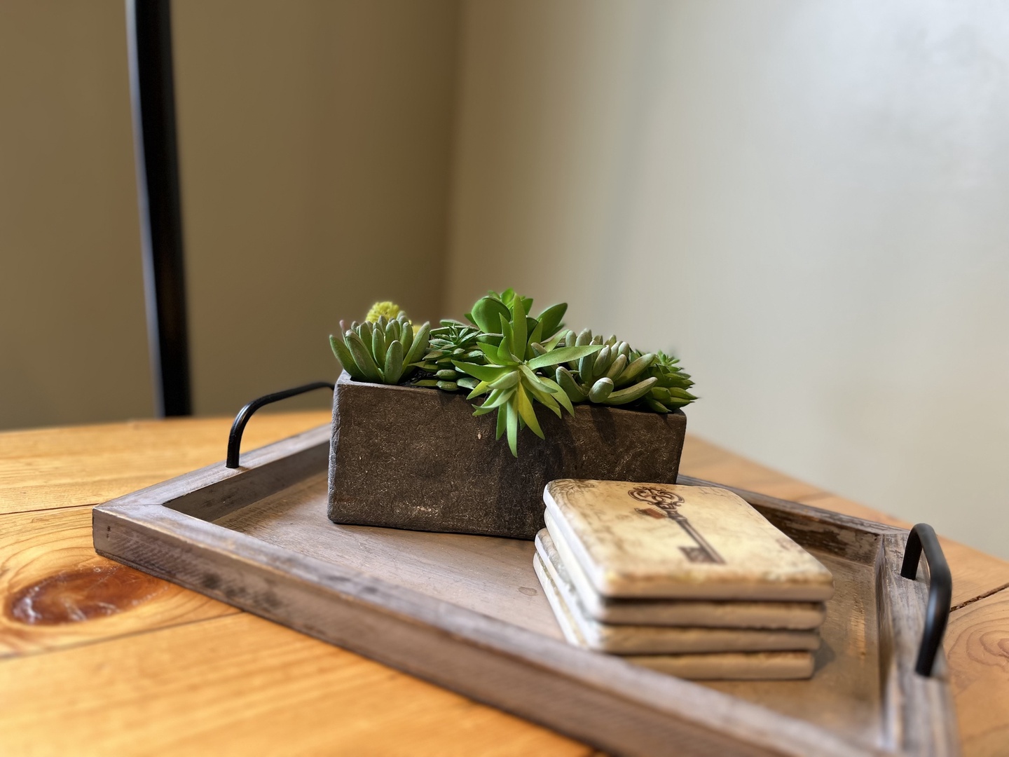 Relax in this cozy mountain retreat featuring a warm fireplace, rustic wooden accents, and plush seating. Enjoy modern amenities like a wall-mounted TV and large windows with bright, natural light.