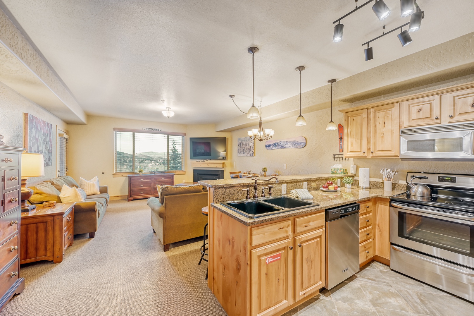 Your spacious open-concept retreat combines a gourmet kitchen with granite counters and a cozy living area.