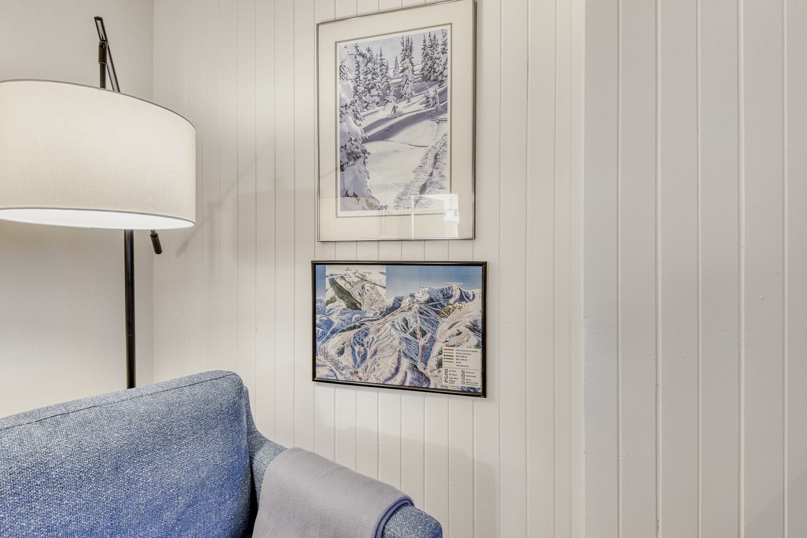 Unwind in your cozy corner with ski-themed art that captures the mountain spirit, perfect for après-ski relaxation.