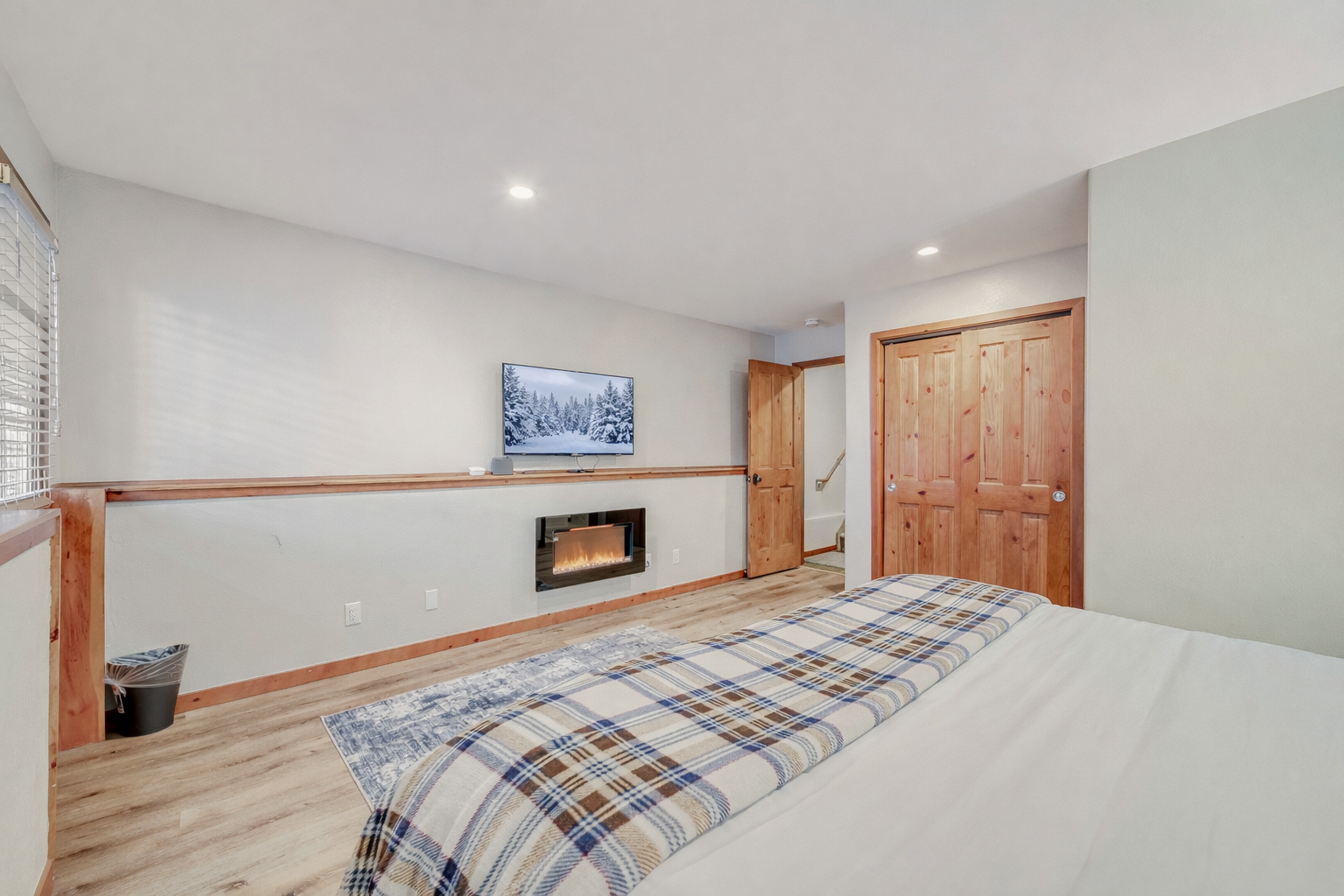 Retreat to your serene bedroom sanctuary featuring warm wood accents, crisp linens, and thoughtful lighting for ultimate relaxation.