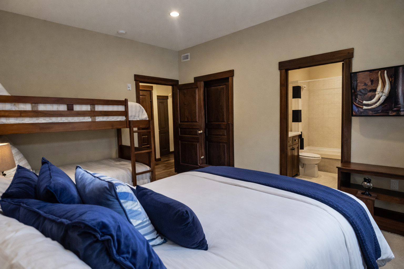 Your spacious bedroom offers comfort for the whole family with a plush king bed and fun bunk beds, plus an ensuite bathroom.