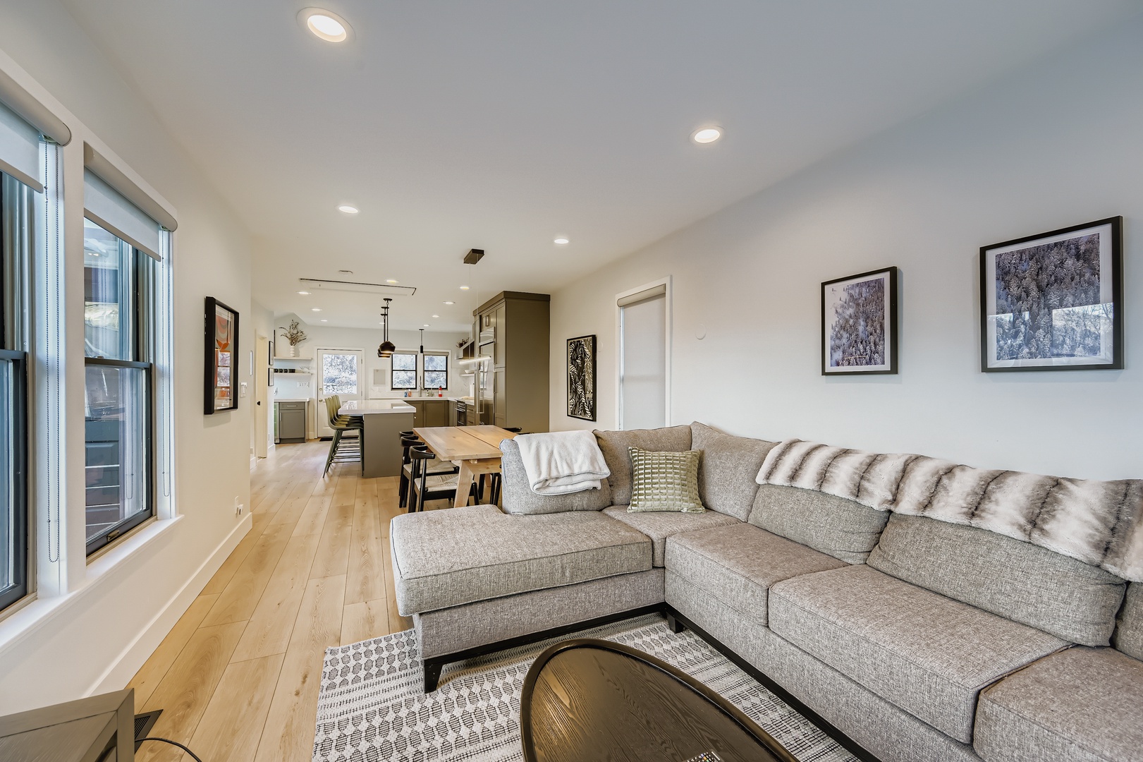Unwind in your open-concept living space where modern design meets cozy comfort. The plush sectional invites you to relax, while the chef-ready kitchen and dining area stand ready for memorable meals together.