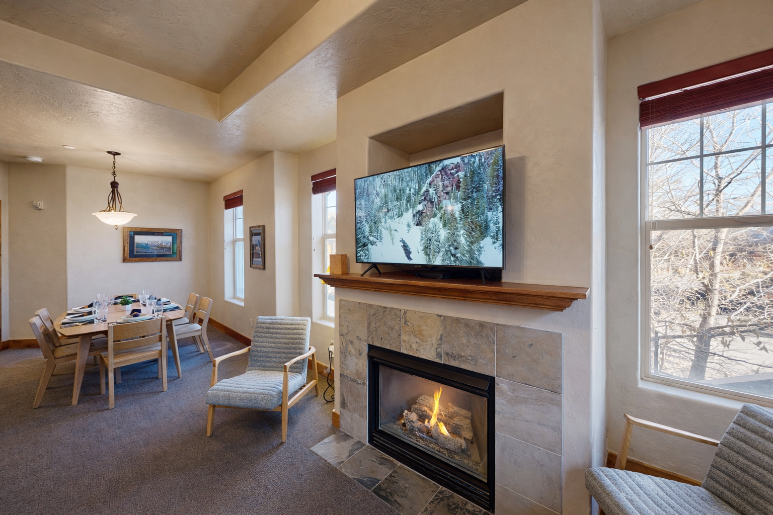 Cozy up by your flickering fireplace while enjoying mountain views on the big screen and dining space for memorable meals together.