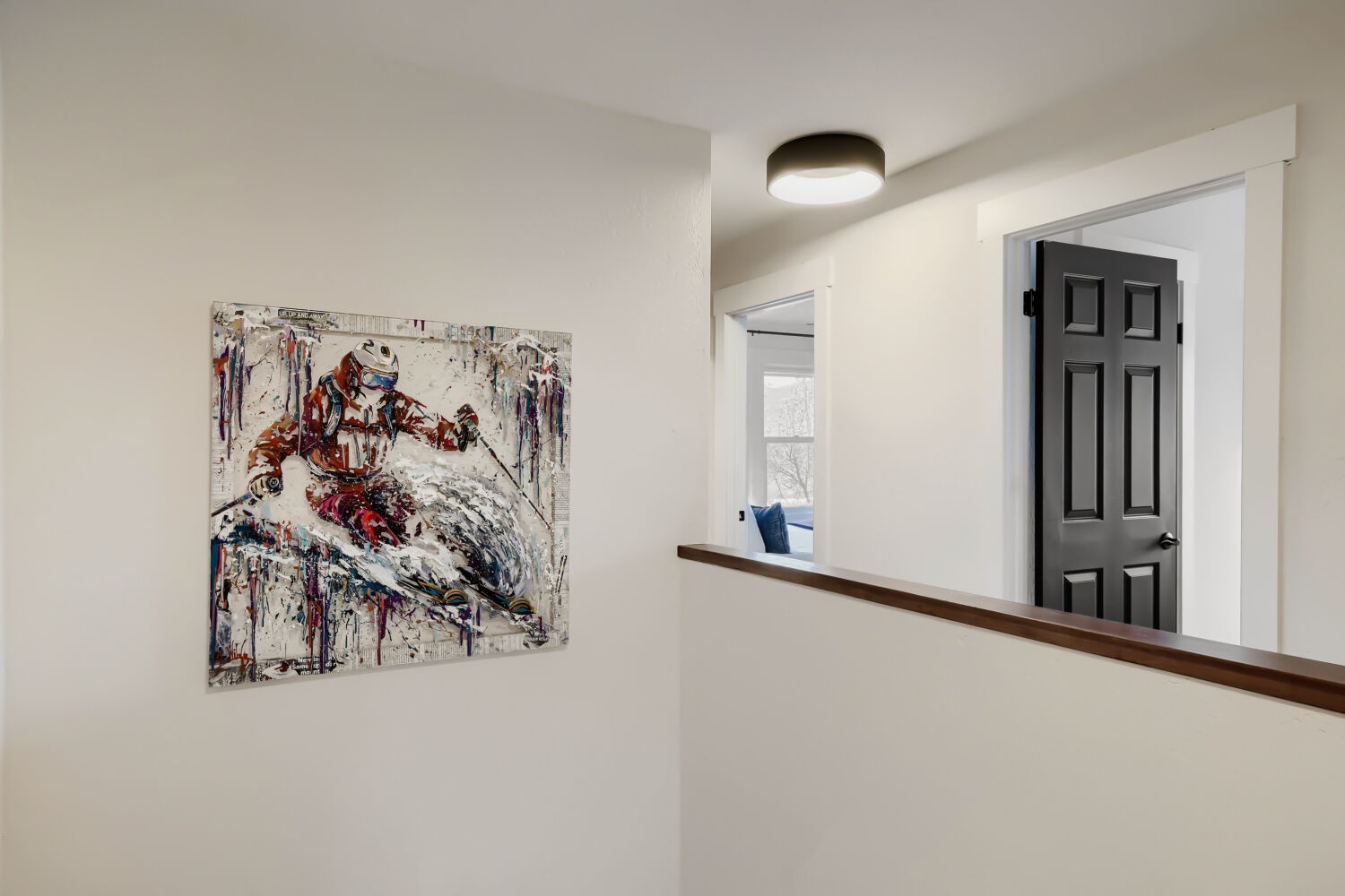 Appreciate the thoughtful touches like local ski art as you move through your spacious retreat, where every detail creates a welcoming mountain atmosphere.
