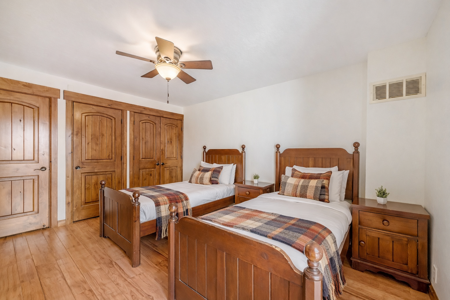 Your cozy twin bedroom offers handcrafted wooden beds with soft linens and rustic charm for a restful mountain getaway.