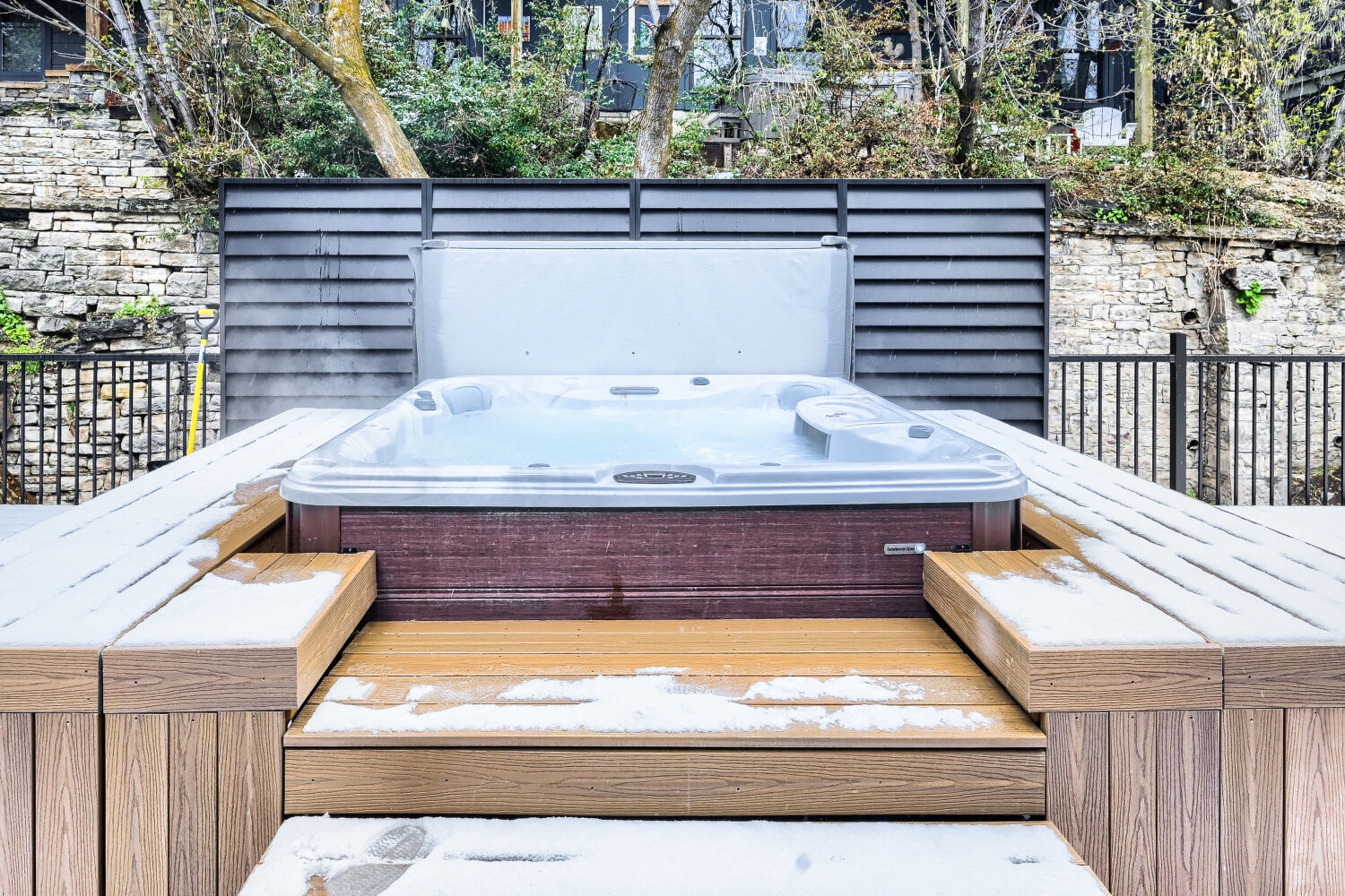 Unwind in the hot tub surrounded by beautiful wooden decking and peaceful garden views.