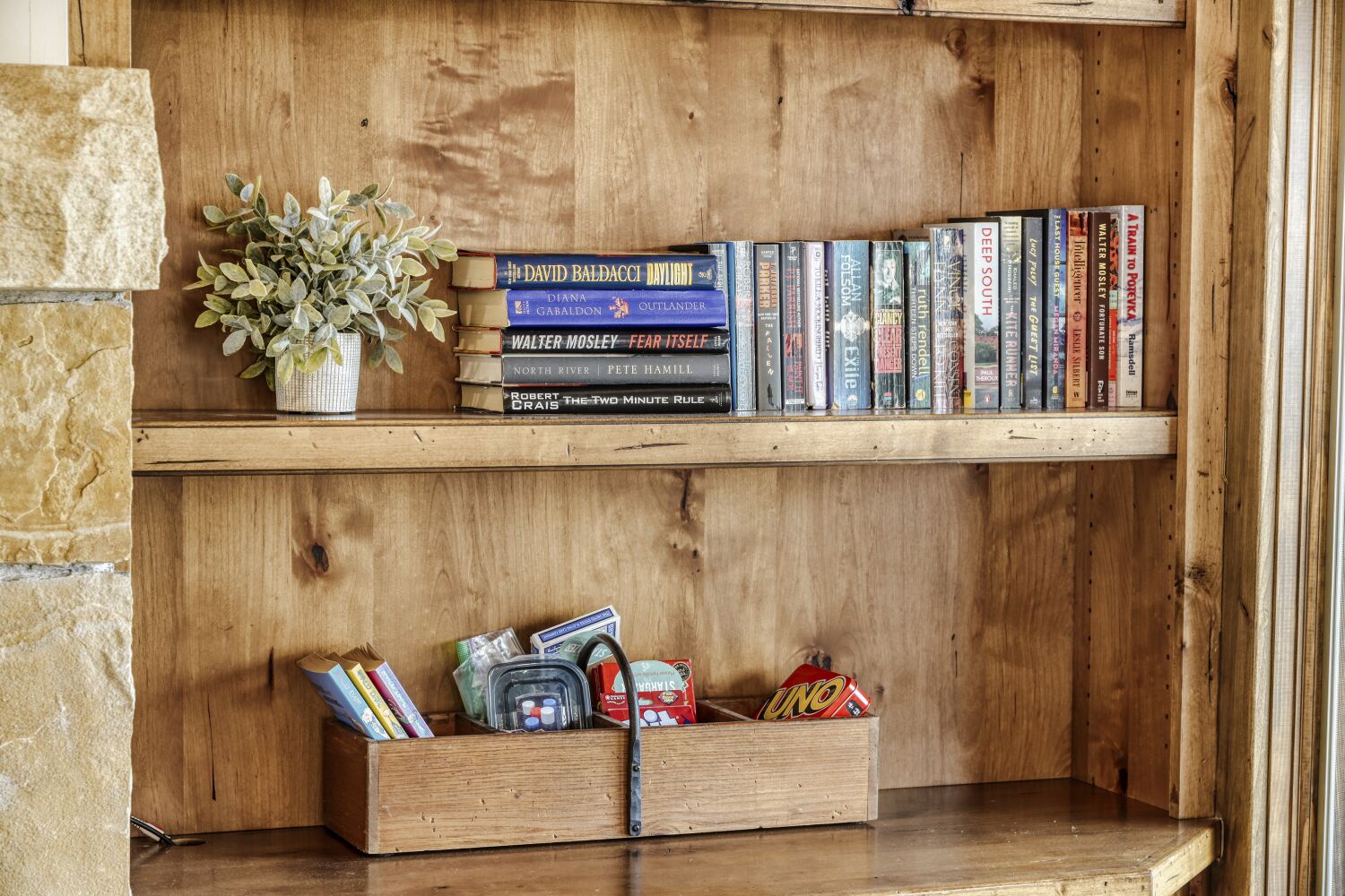 Cozy up with your favorite novel from this charming bookshelf, complete with games for those perfect evening moments of relaxation.