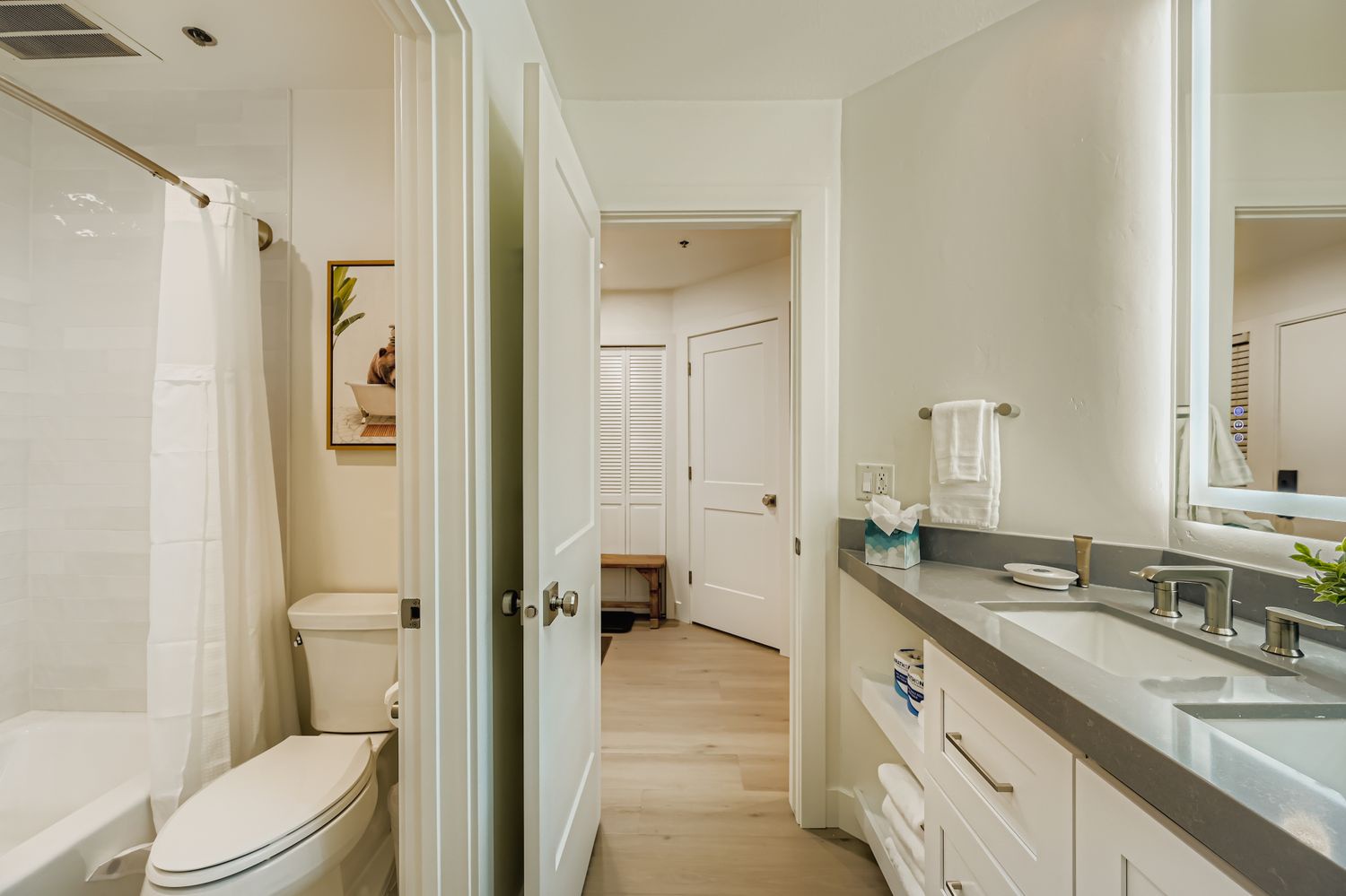 Your bright, well-appointed bathroom features fresh towels, modern fixtures, and a soothing neutral palette for a refreshing start to your day.