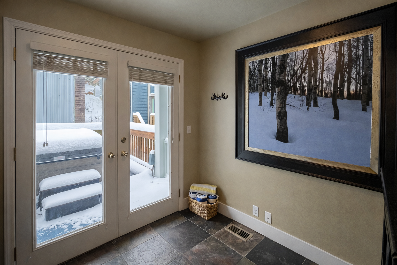 Warm up in your cozy entryway after snowy adventures, with beautiful winter artwork setting the seasonal mood.