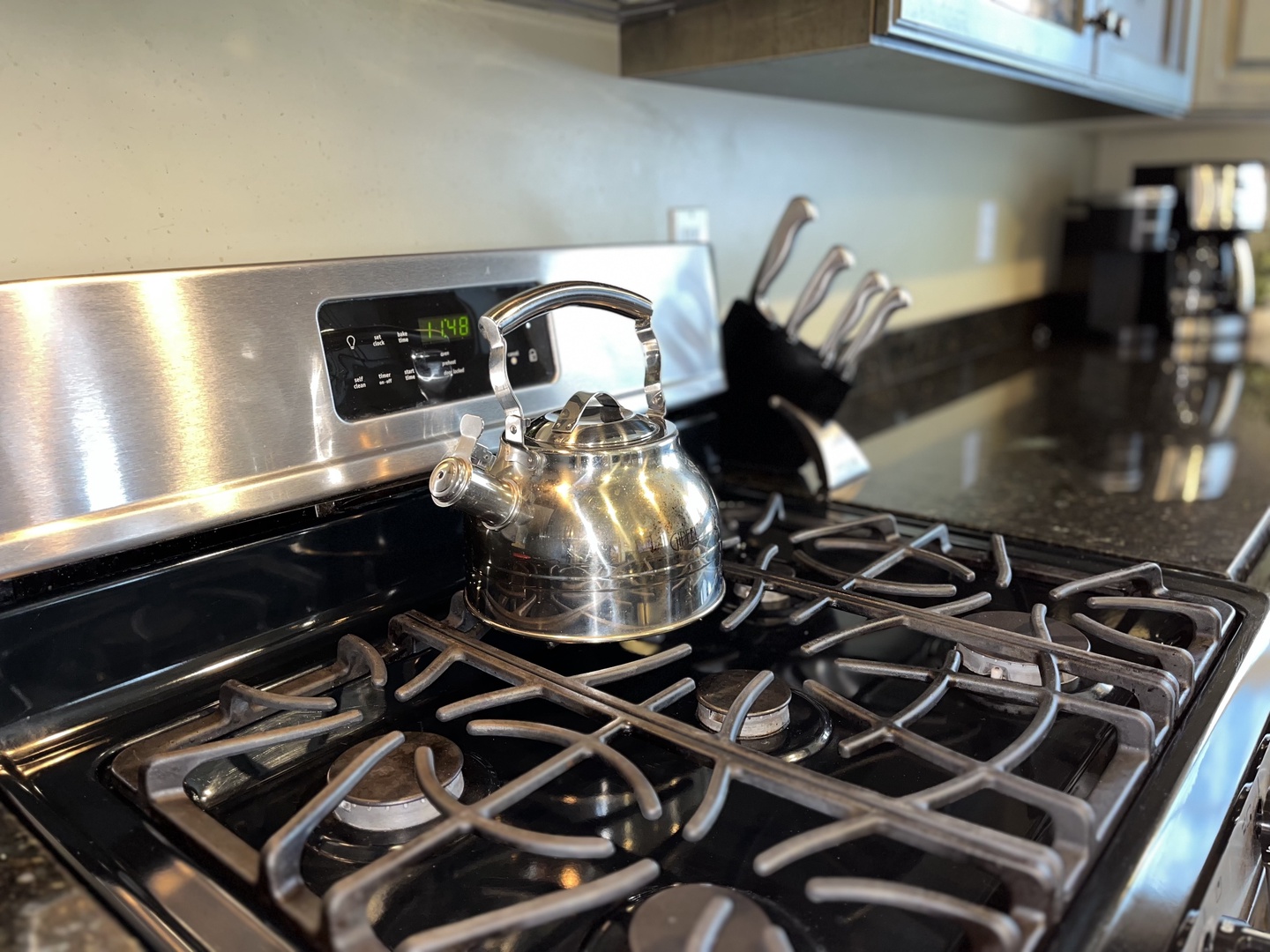 Cook your favorite meals in this fully-equipped kitchen featuring stainless steel appliances, granite countertops, and ample cabinet space for all your culinary adventures.