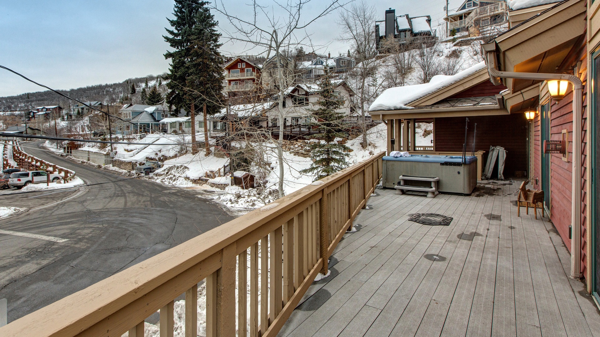 Step onto your private deck and soak in the hot tub while snowy mountain views surround you in this peaceful winter retreat.