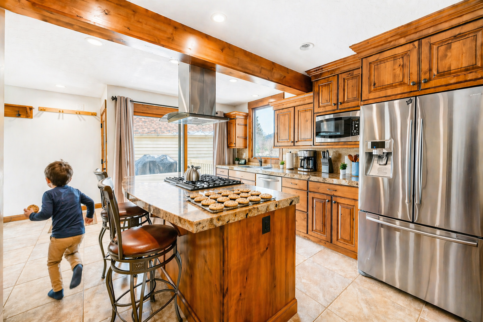 Your gourmet kitchen awaits with granite counters, stainless appliances, and rustic beams—perfect for creating memorable family meals together.