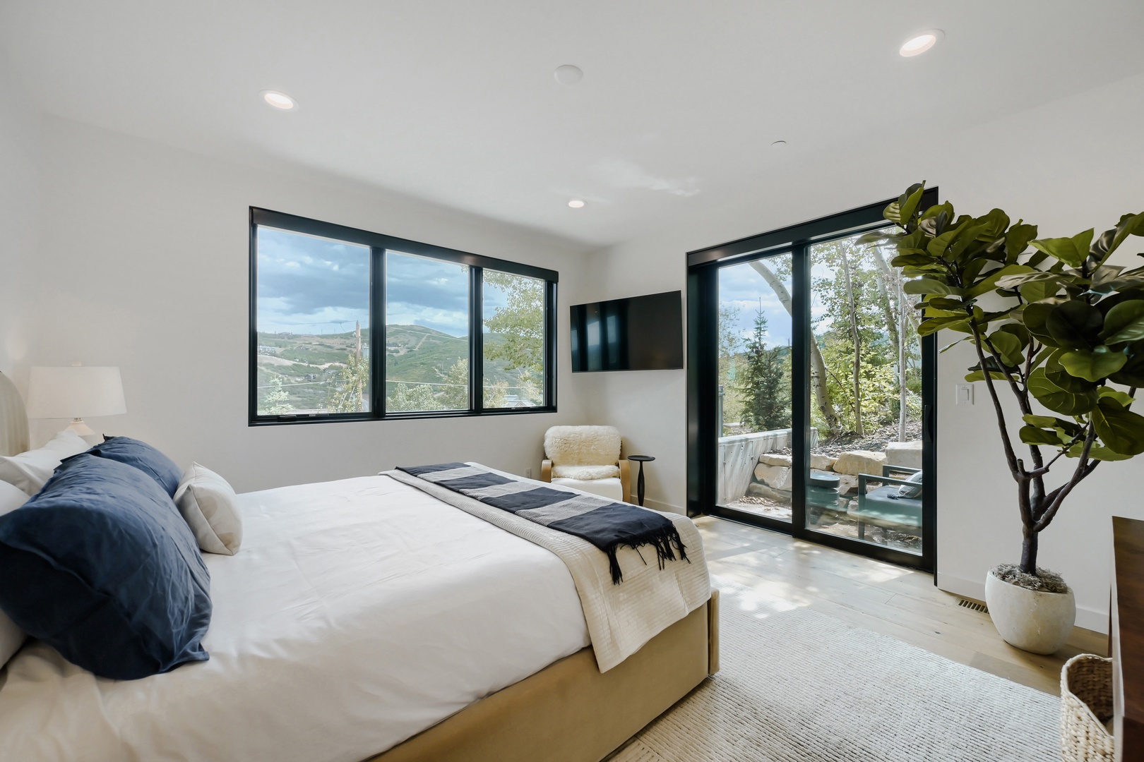 Wake up to stunning mountain views framed by modern black-trimmed windows, while your private balcony beckons you to start each morning surrounded by natural beauty and fresh air.
