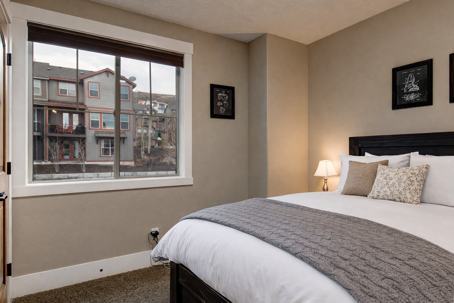 Sink into crisp linens and plump pillows in your peaceful bedroom sanctuary, where warm lighting and thoughtful decor create the perfect retreat.