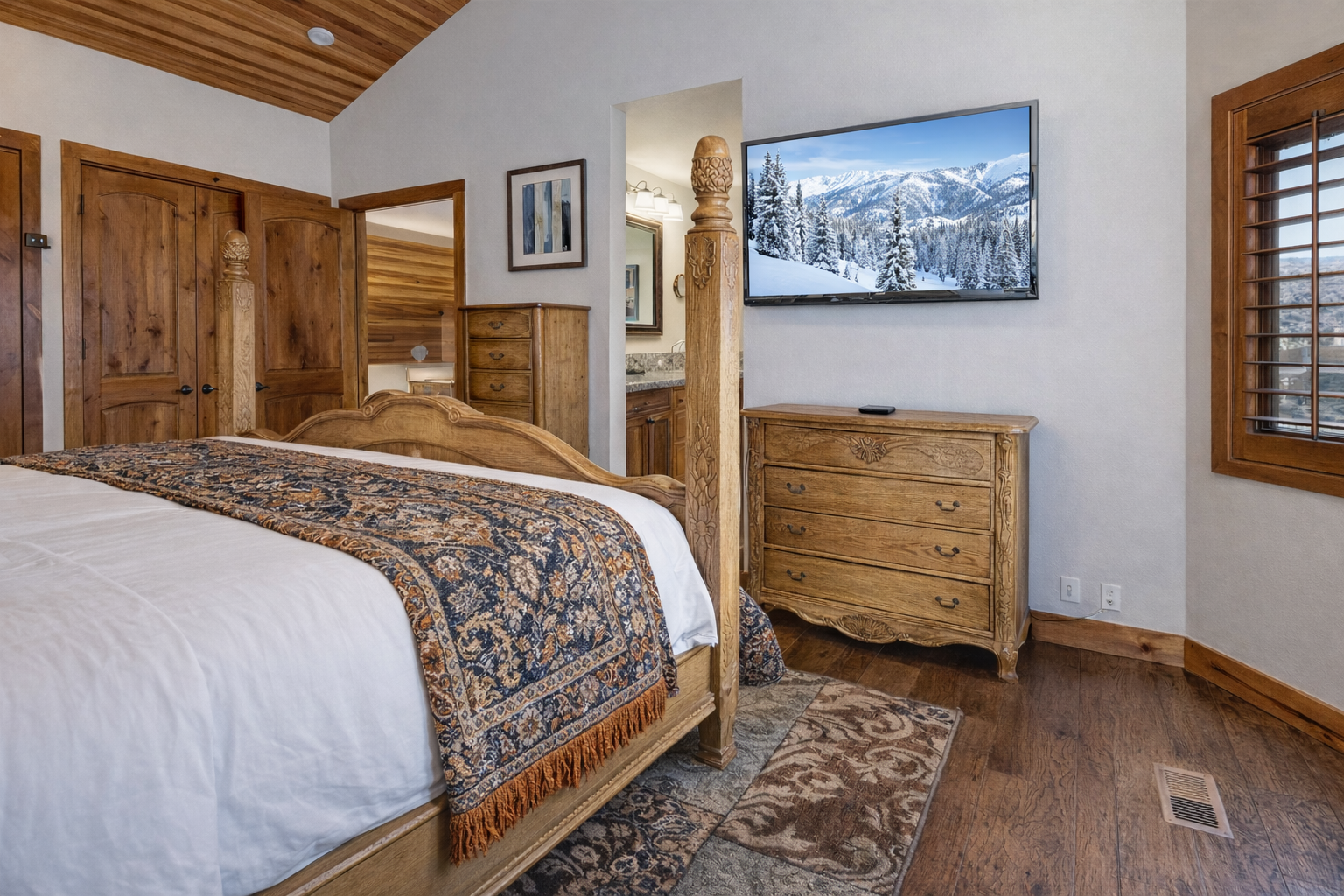 Drift into mountain dreams on luxurious linens while your private TV showcases alpine vistas through the window.