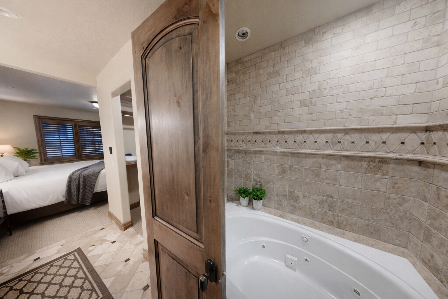 This sophisticated en-suite offers a beautiful granite vanity and dark wood cabinetry just steps from the bedroom. It’s a seamless blend of convenience and mountain-chic luxury for your stay.