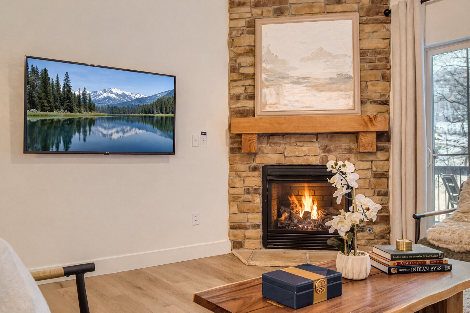 Cozy up by the stone fireplace in this luxury Park City townhome. Features a large flat-screen TV and elegant mountain-themed decor—the perfect year-round alpine retreat.